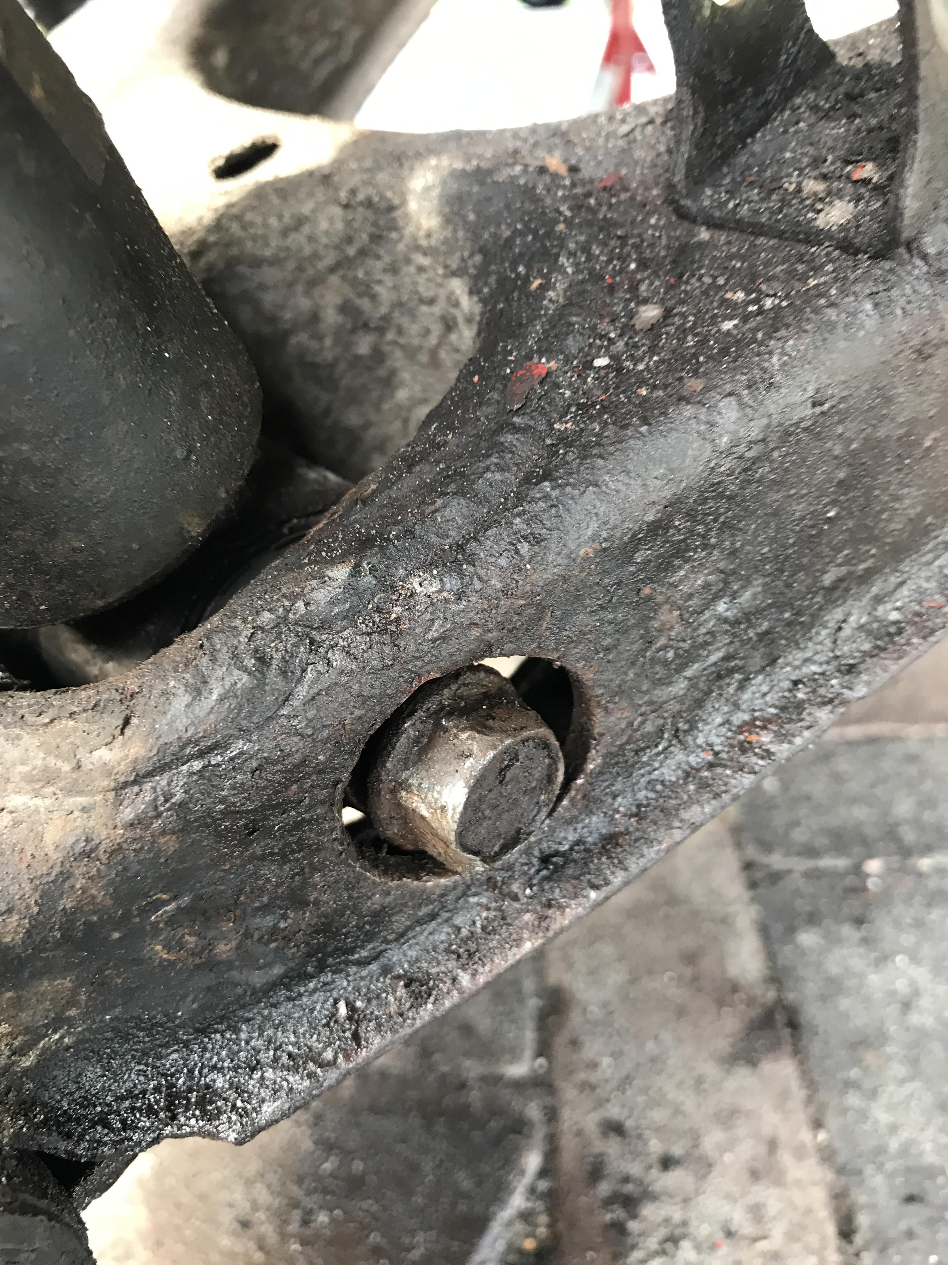 The bolt connecting the rear shocks to the lower control arm wont move. I’ve tried turning it