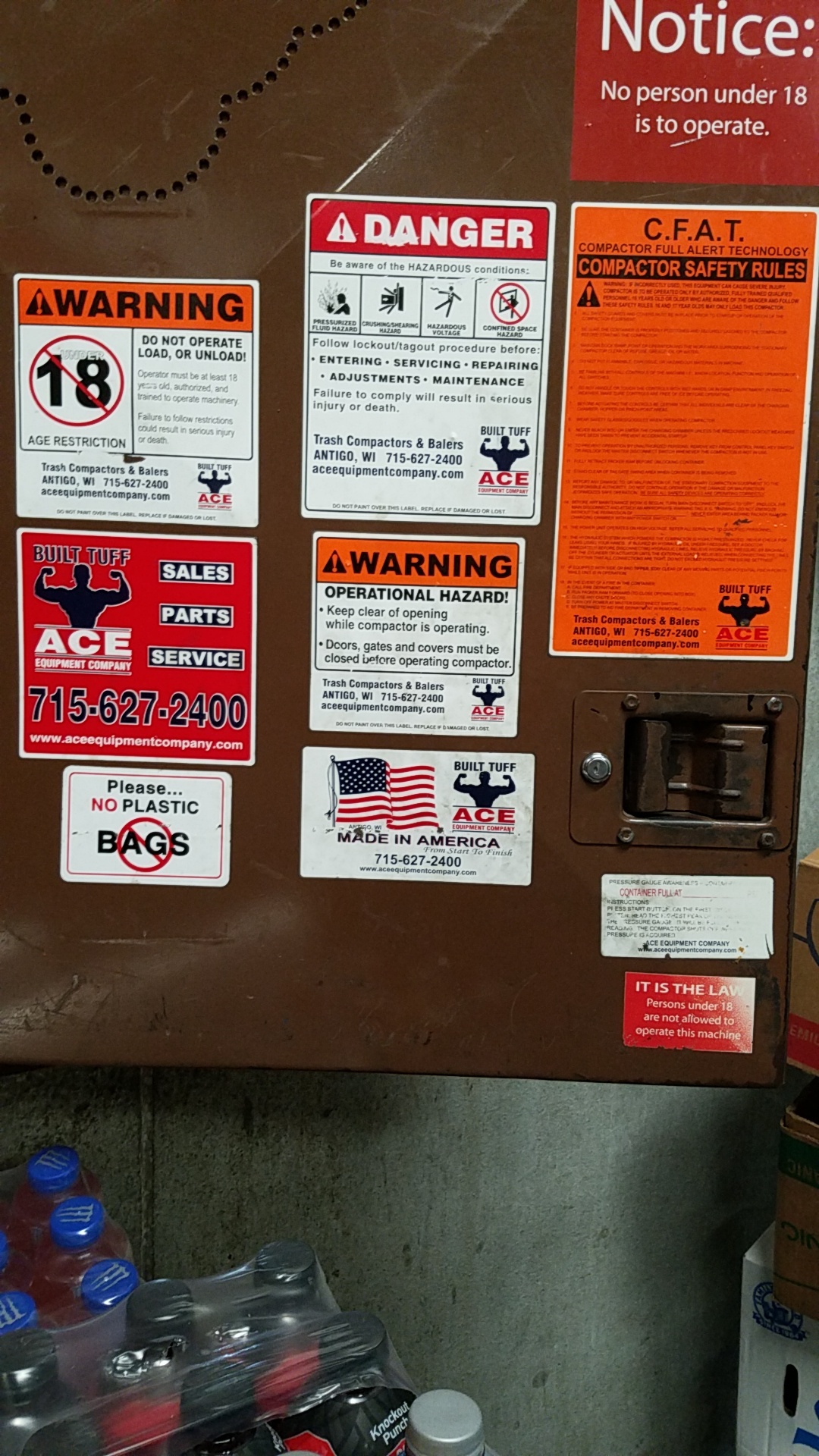 All of the danger signs on the cardboard compactor at my work. r
