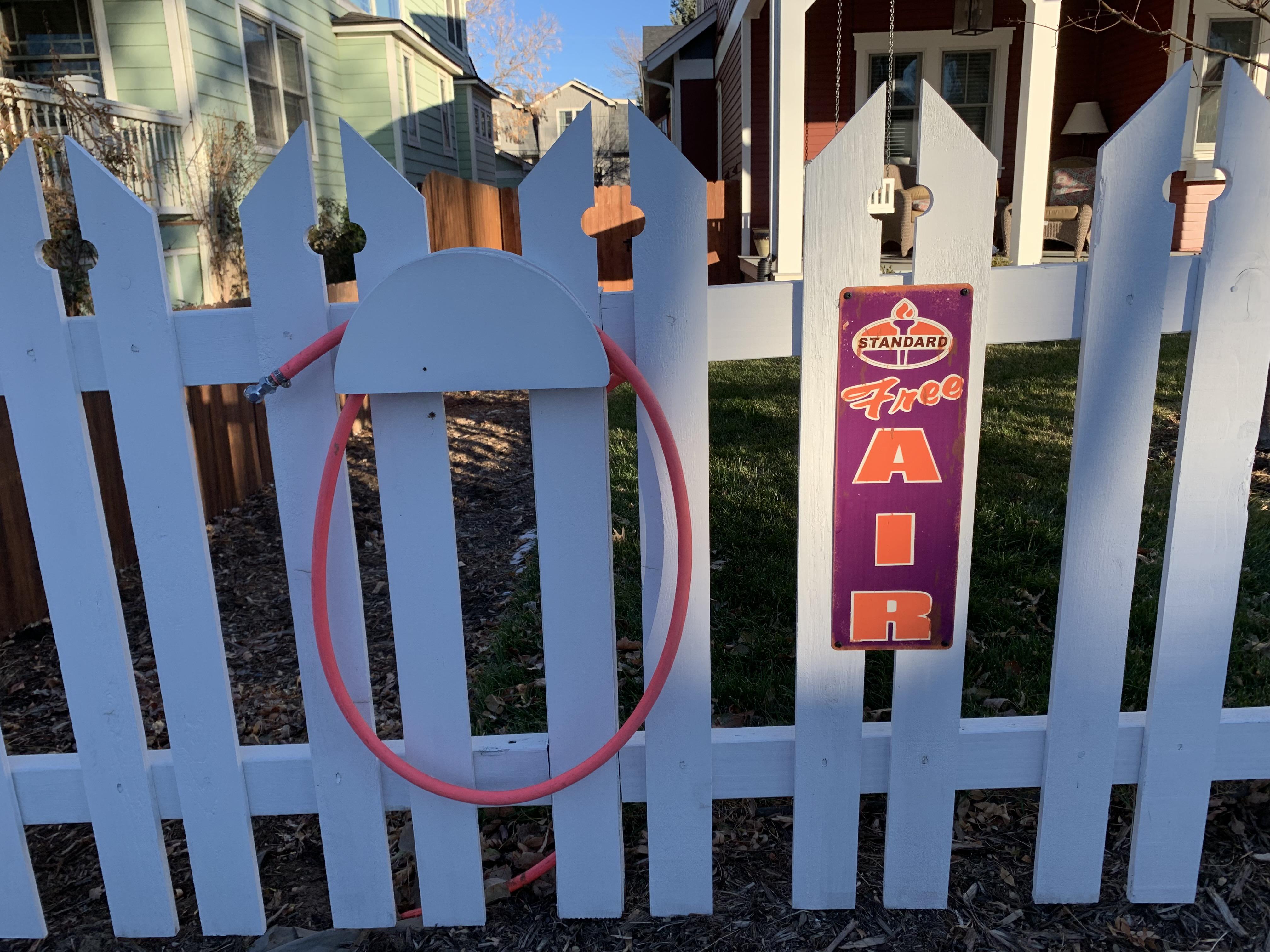 Someone down the street set up an air hose for bikes in their front