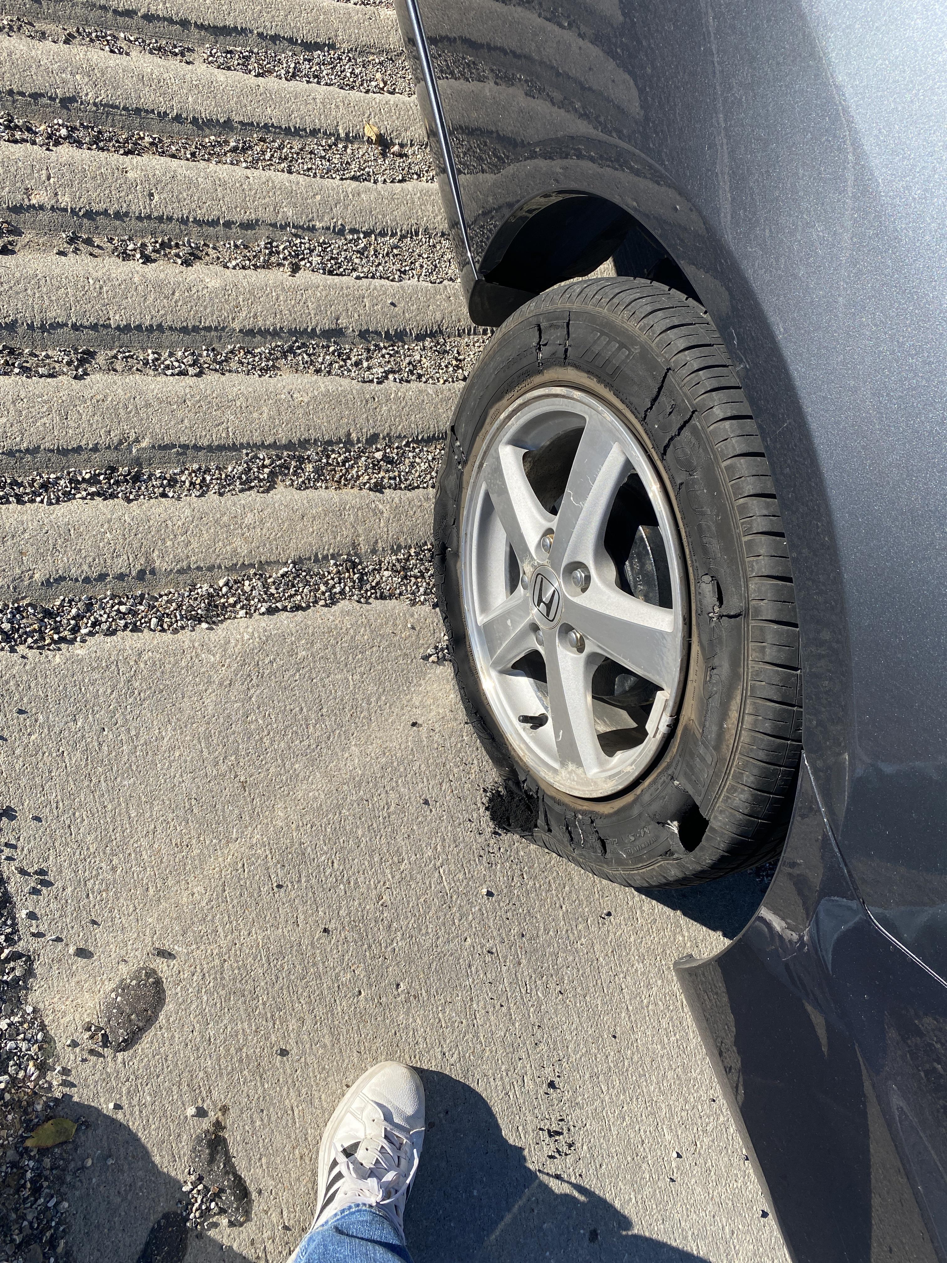 Could anyone tell me how a tire popped like this? Left rear tire popped