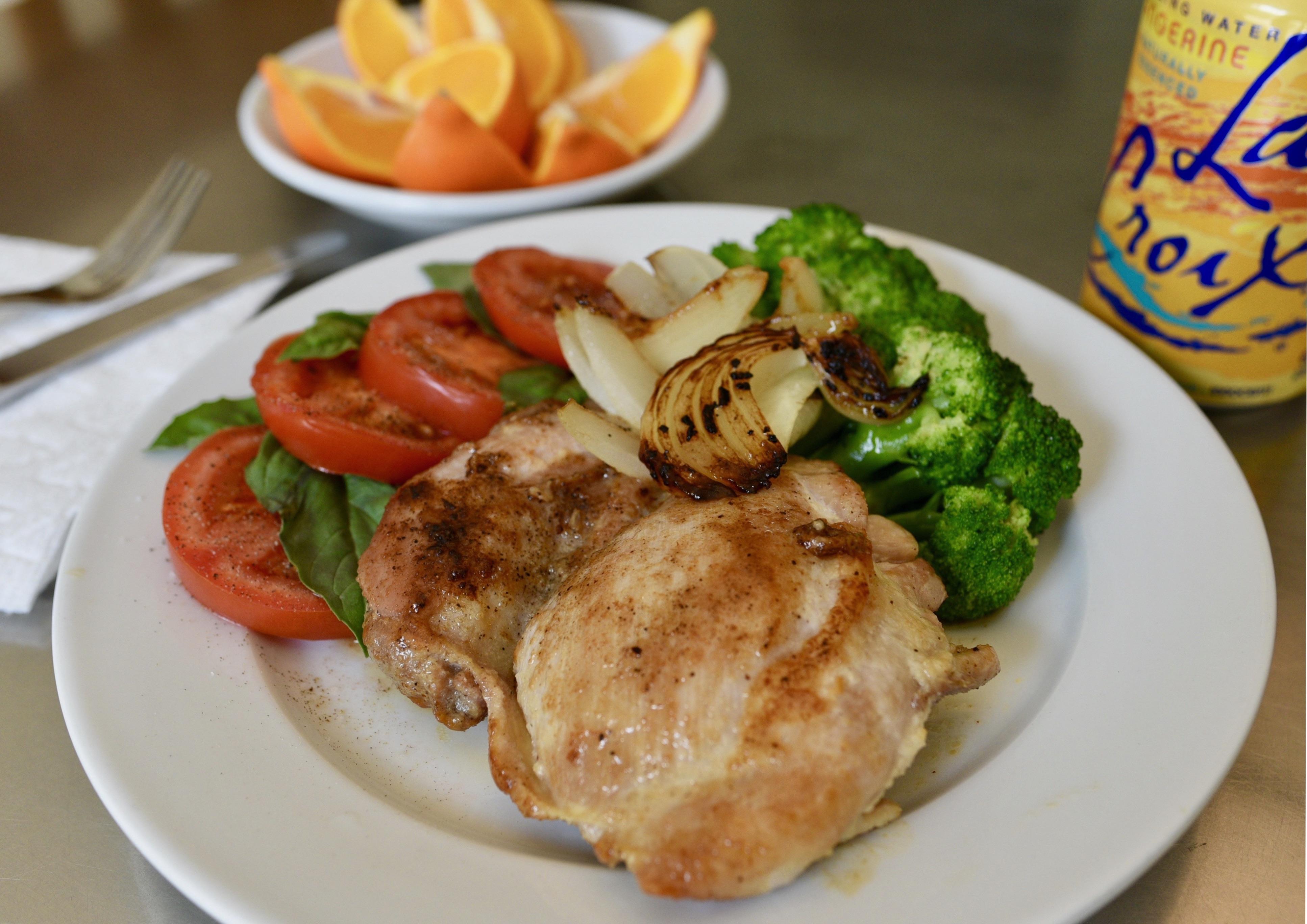 [homemade] pan roasted chicken thigh, steamed broccoli, grilled onions, fresh tomatoes & basil