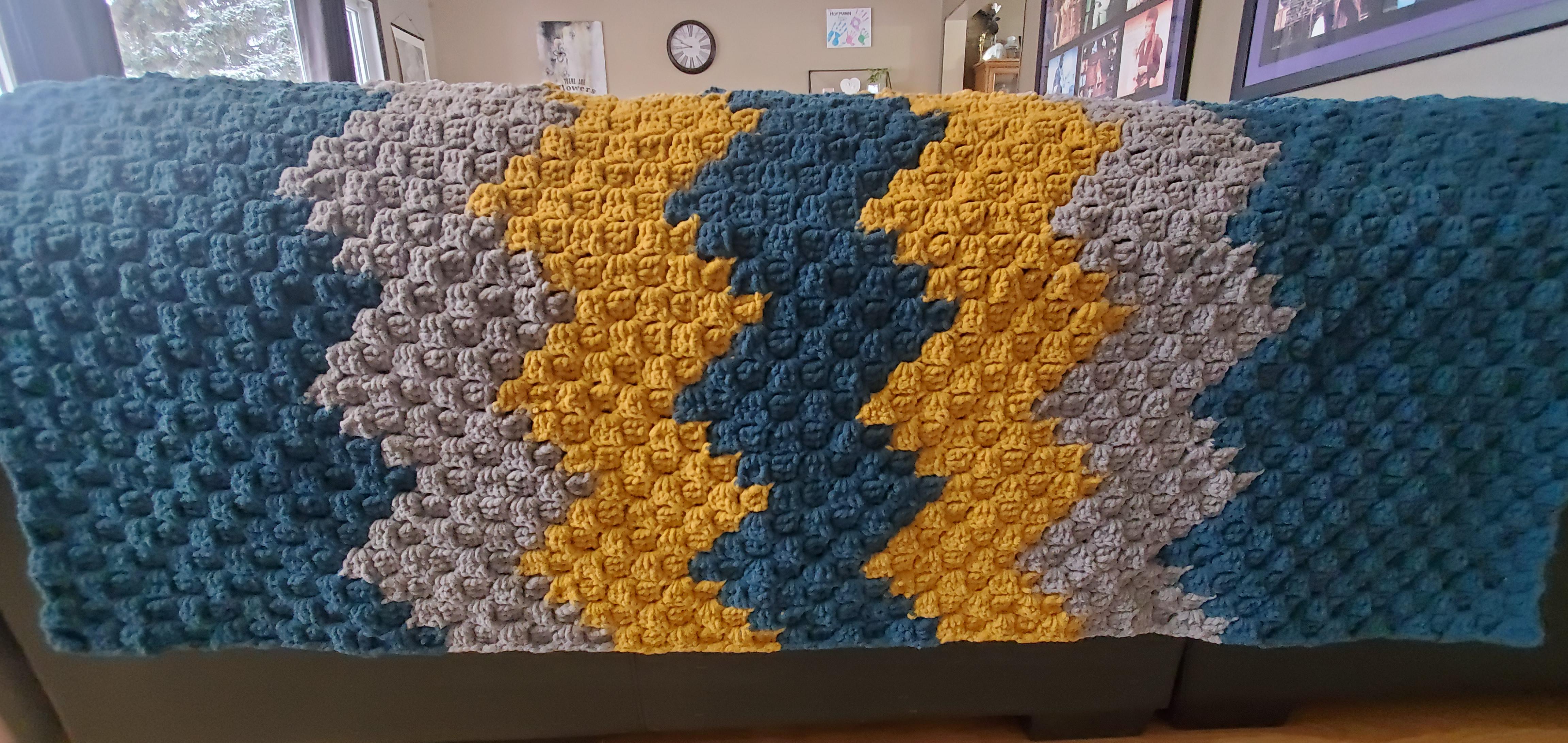 Finally finished this blanket for a friend. It is uneven and has some