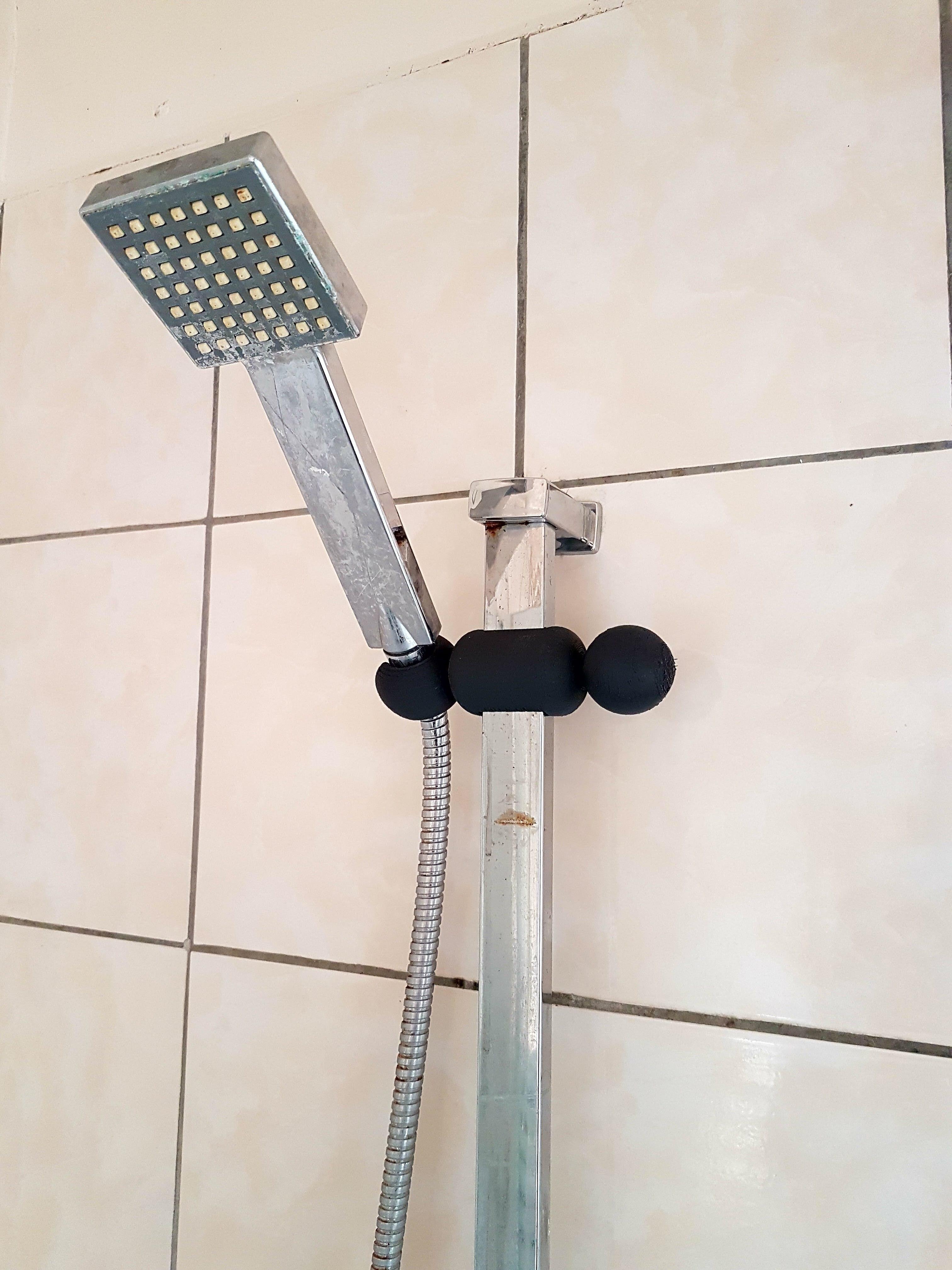 There was no showerhead's holder in the apartment we moved in. Dad fixed the problem ). r