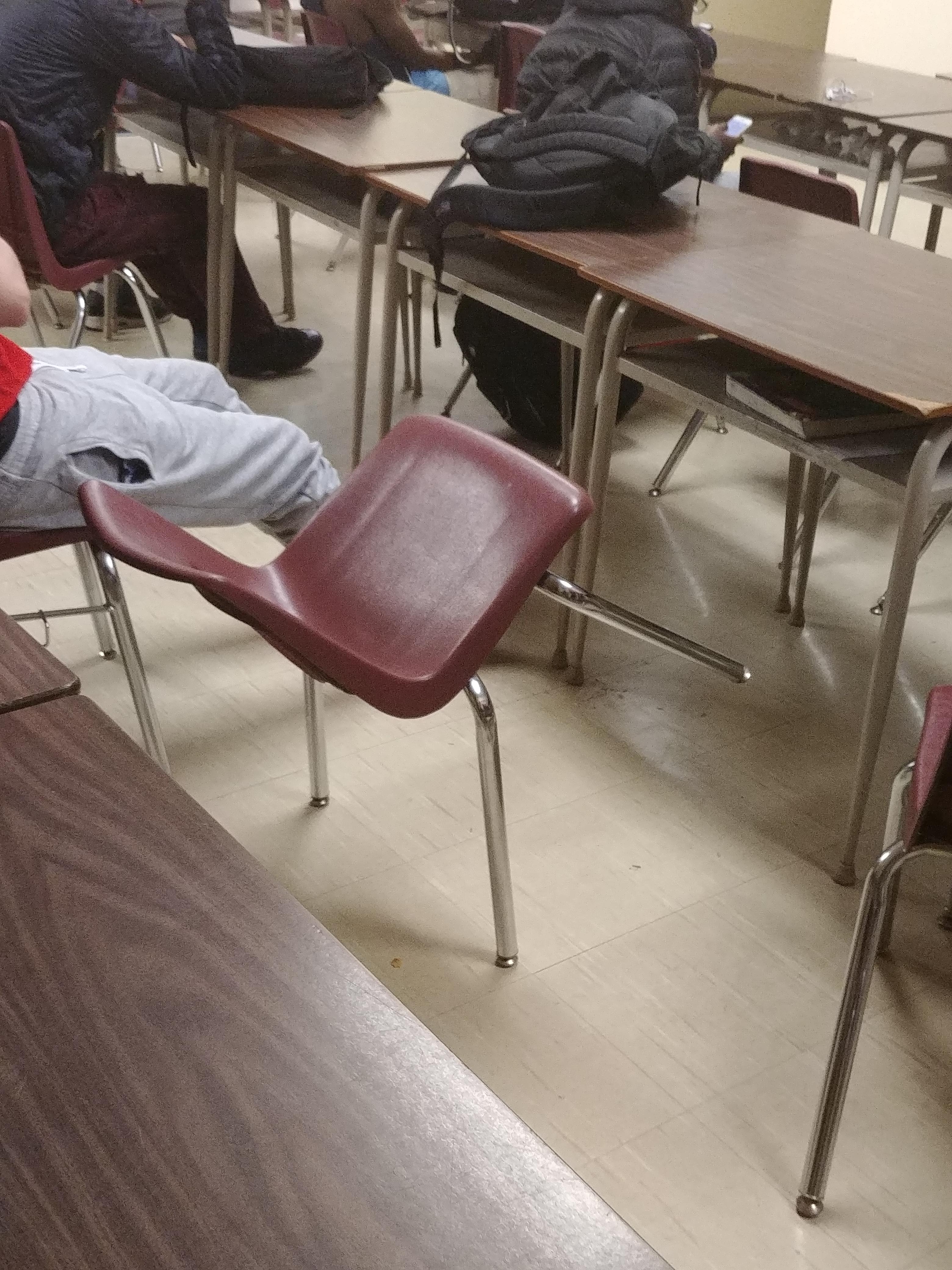 A classmate managed to balance this chair on 2 legs r/mildlyinteresting