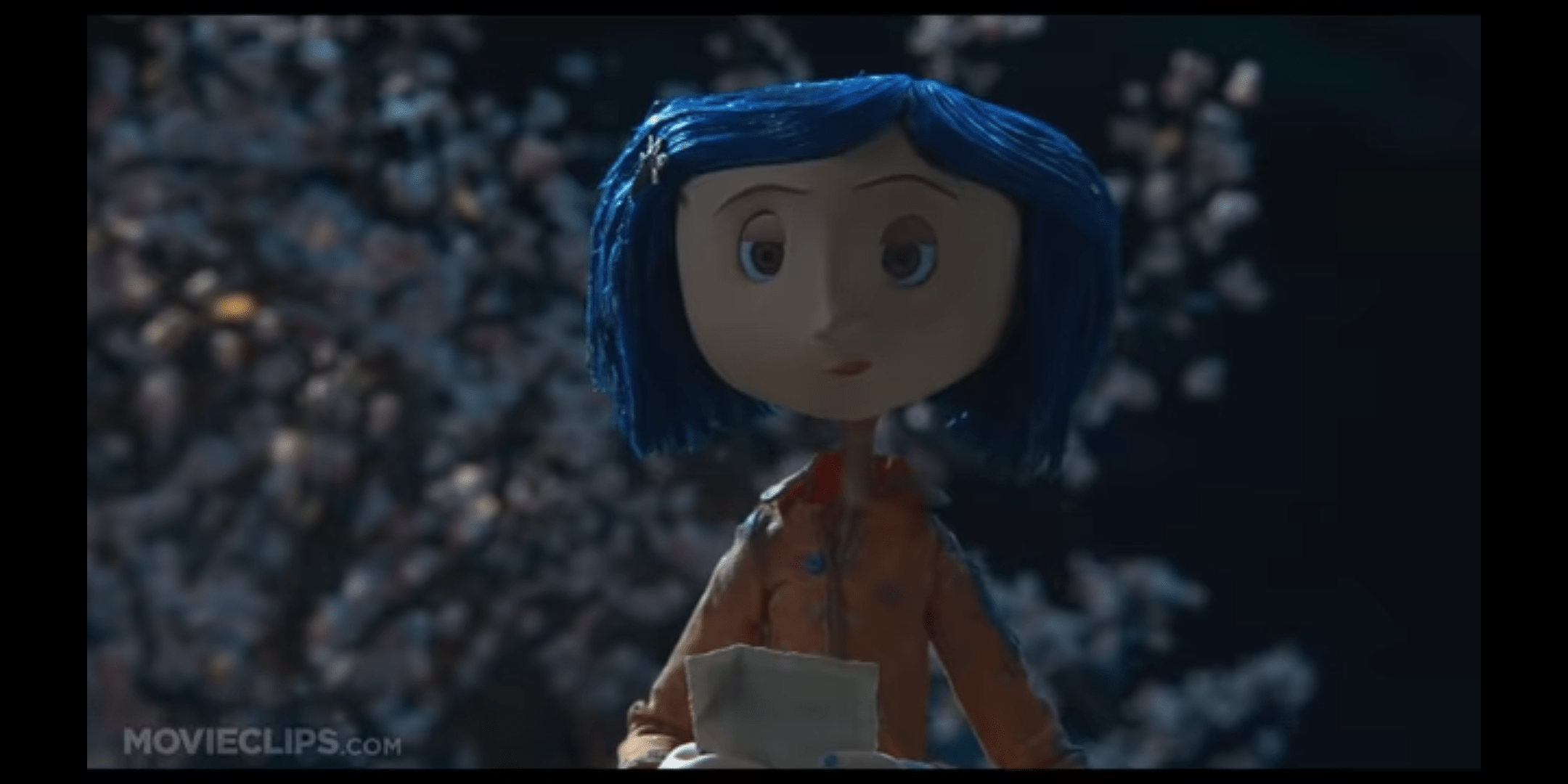 In Coraline (2009) you can see a red mark on the top of Coraline's neck