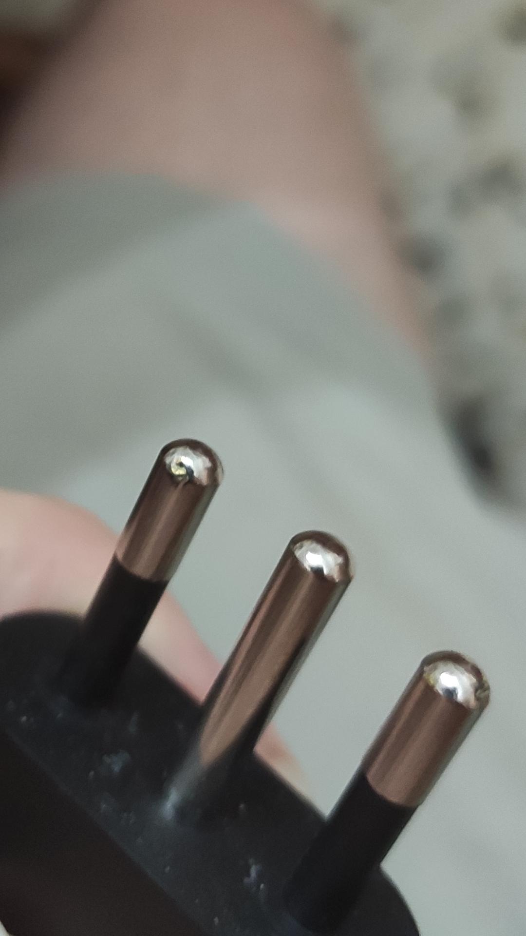slightly burnt prongs on laptop charger caused by arcs, still usable? r/askanelectrician