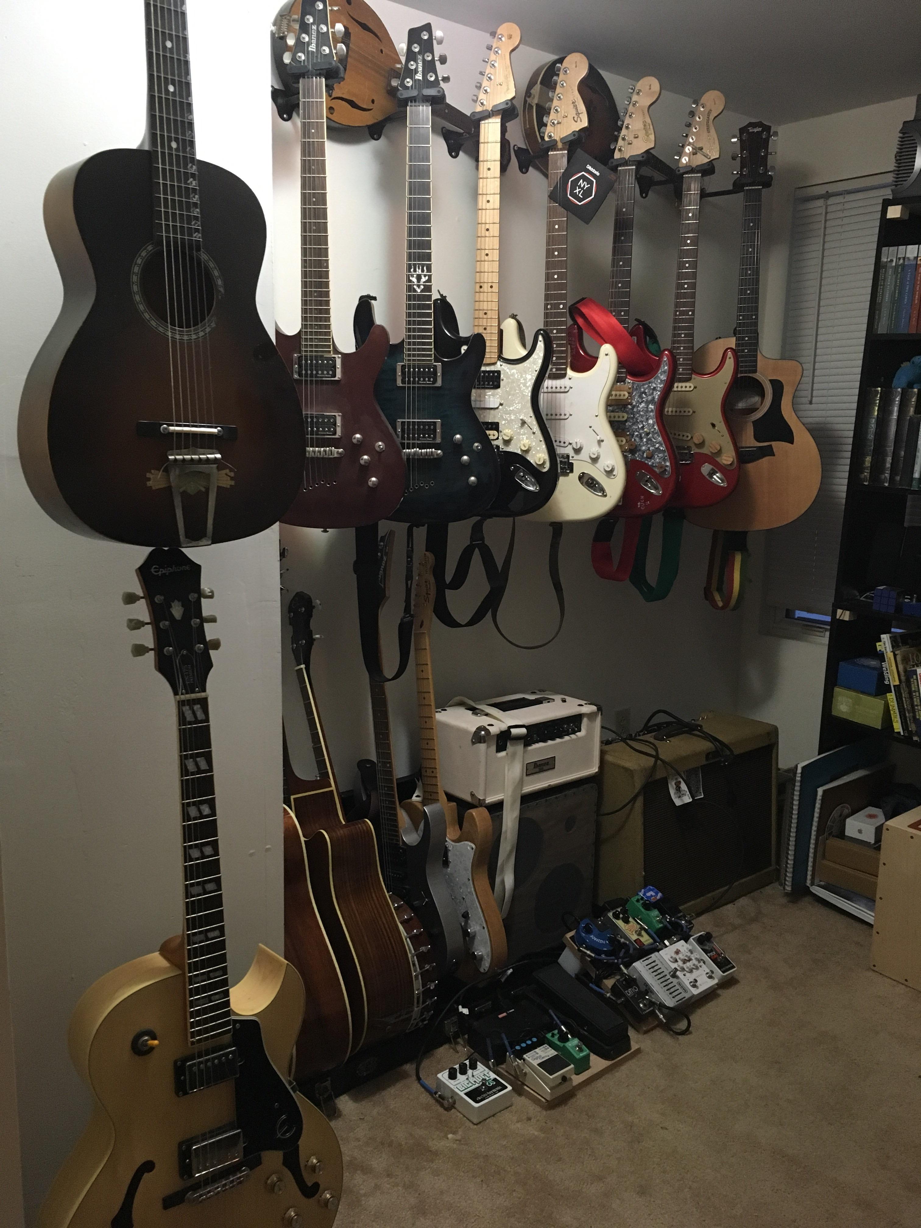 Got the whole family together. 13 guitars, 2 mandolins, and one banjo