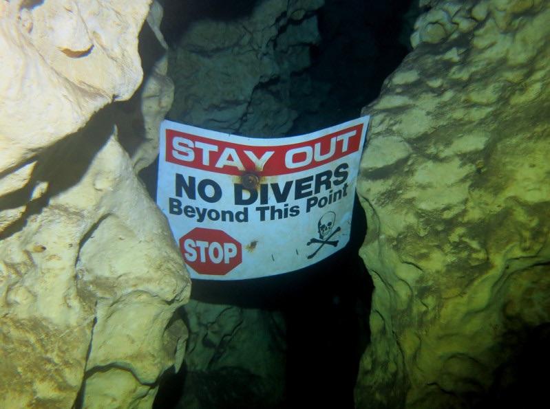 This haphazardly placed cave diving sign gives me chills. ScarySigns