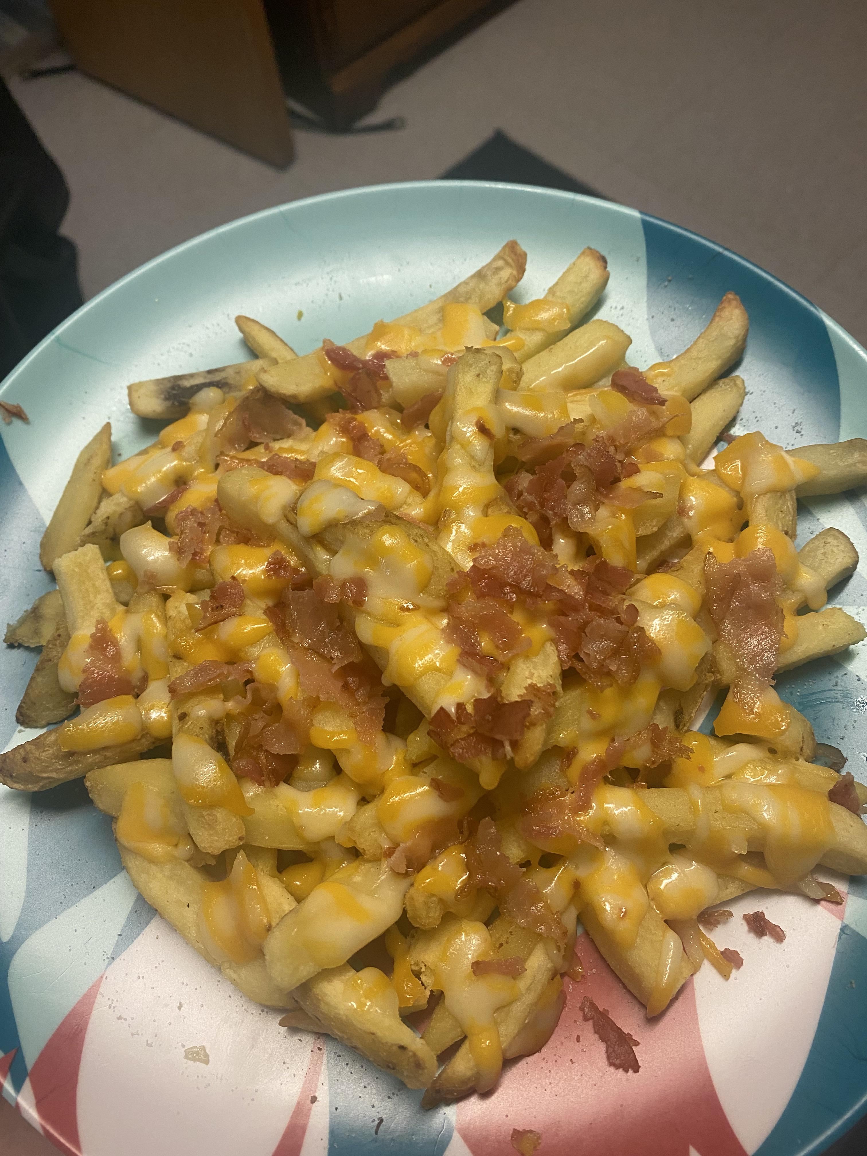 French fries, cheese, bacon, and ranch on the side. dorm made r