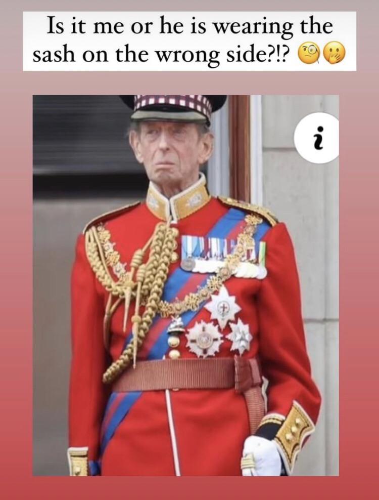 Maybe he he was putting on the sash of the Most Distinguished