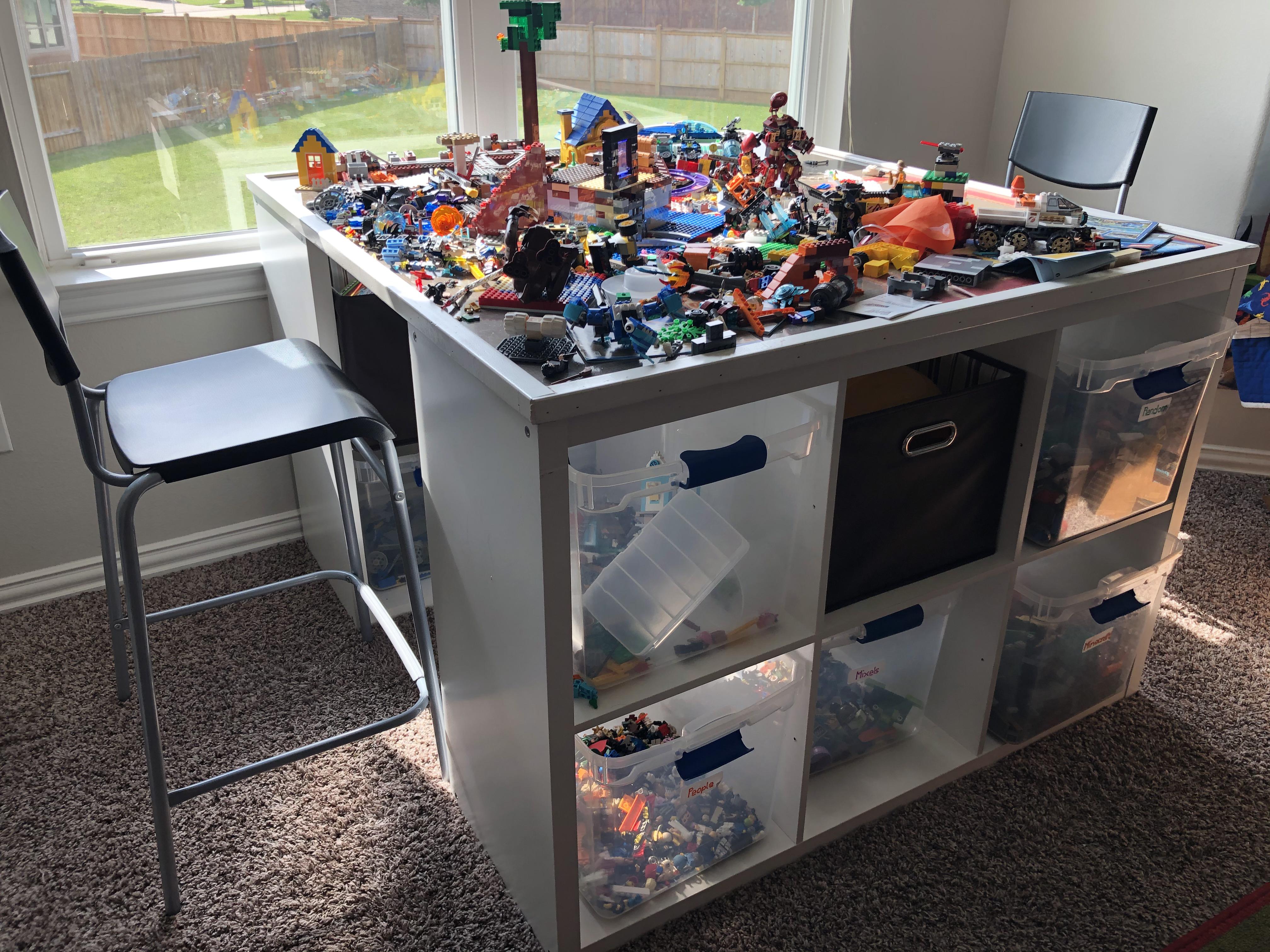 My kids’ first workbench for LEGO construction and storage bins. Used