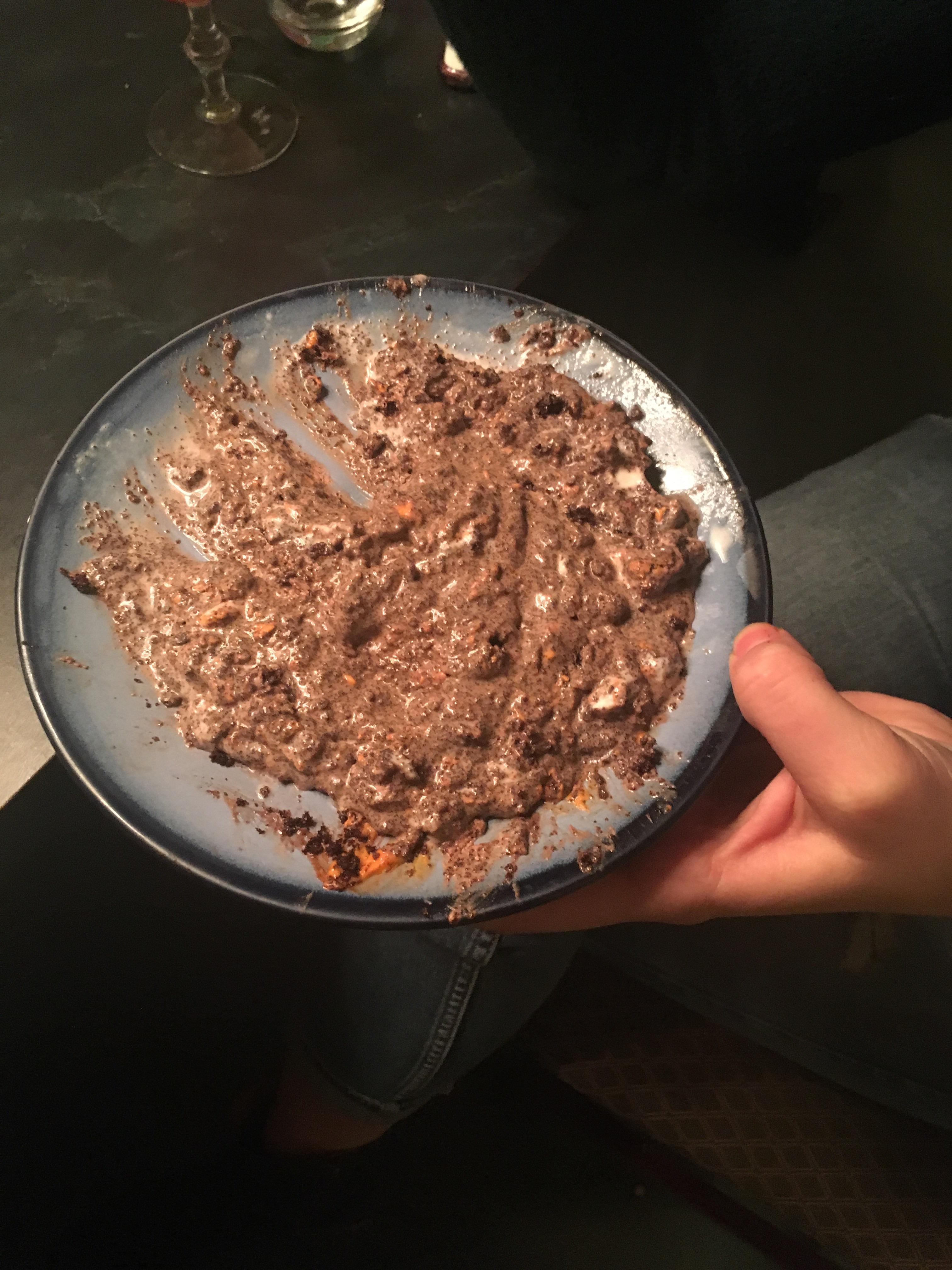 My girlfriend makes a pile of chocolate cake mashed with vanilla ice