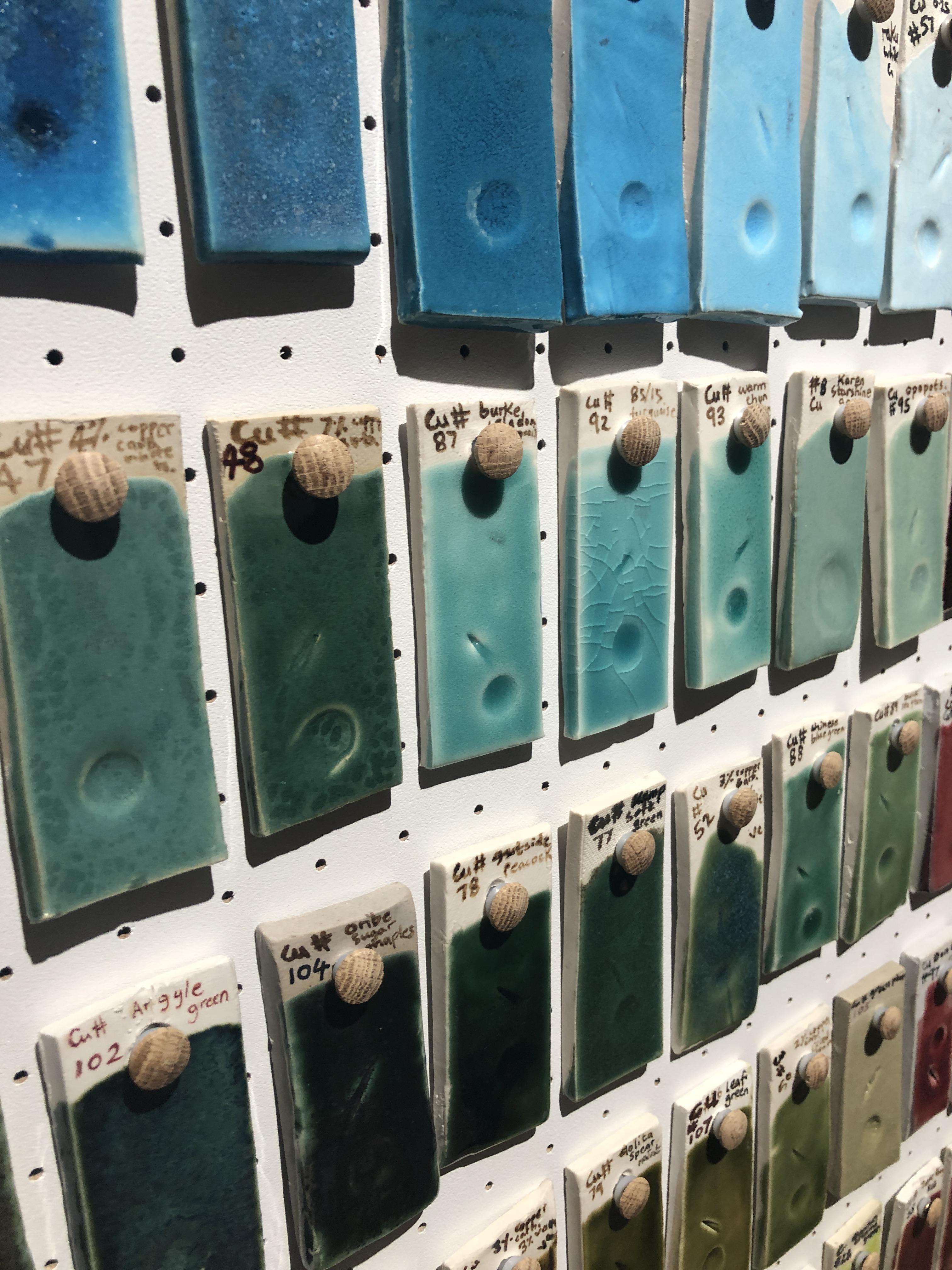 A section of the Glaze library, a wall of glazes displayed at Aberdeen