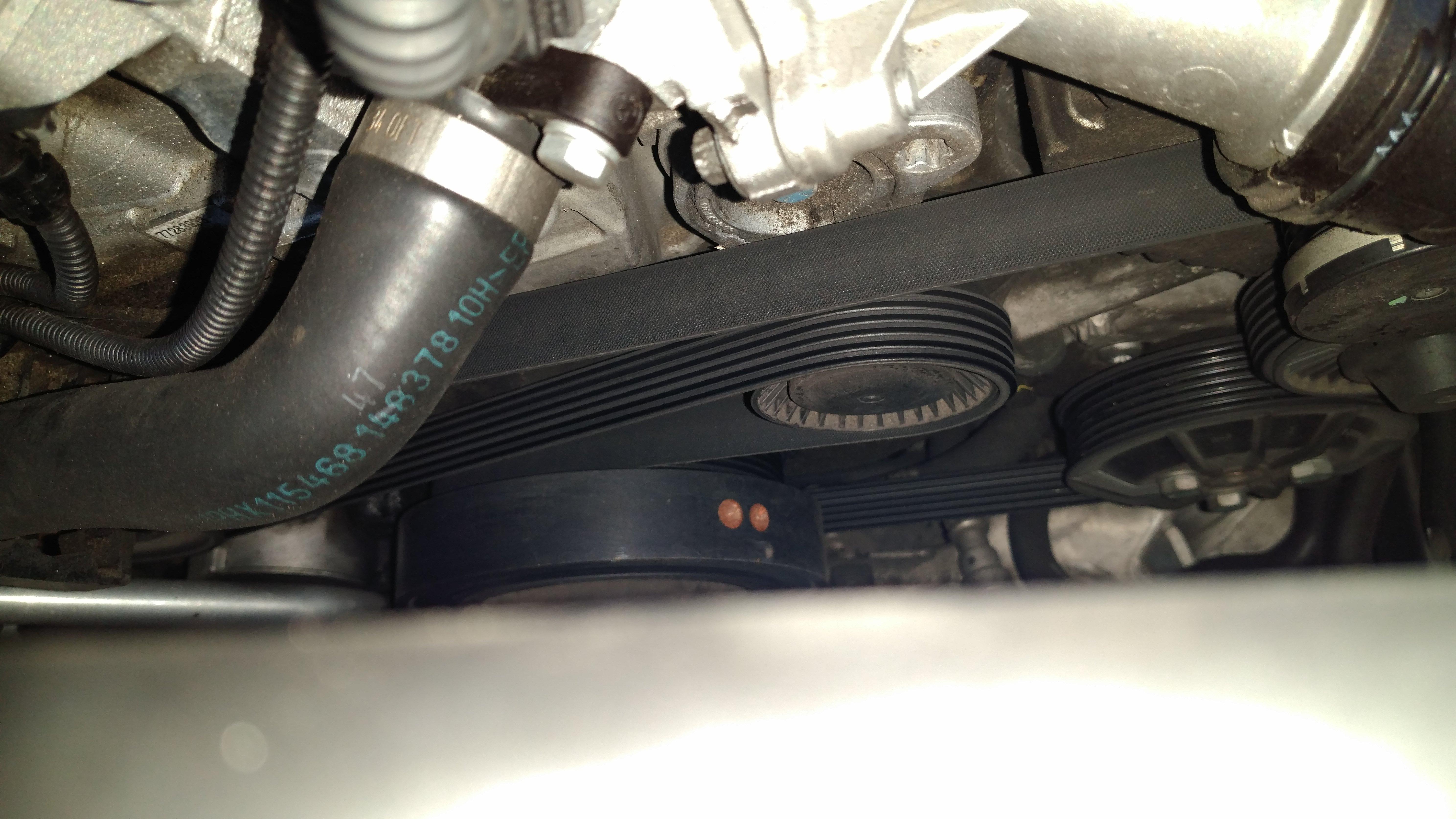 Tensioner and belt on my BMW 328i E90. Is it seated right or is the belt slipping off the front