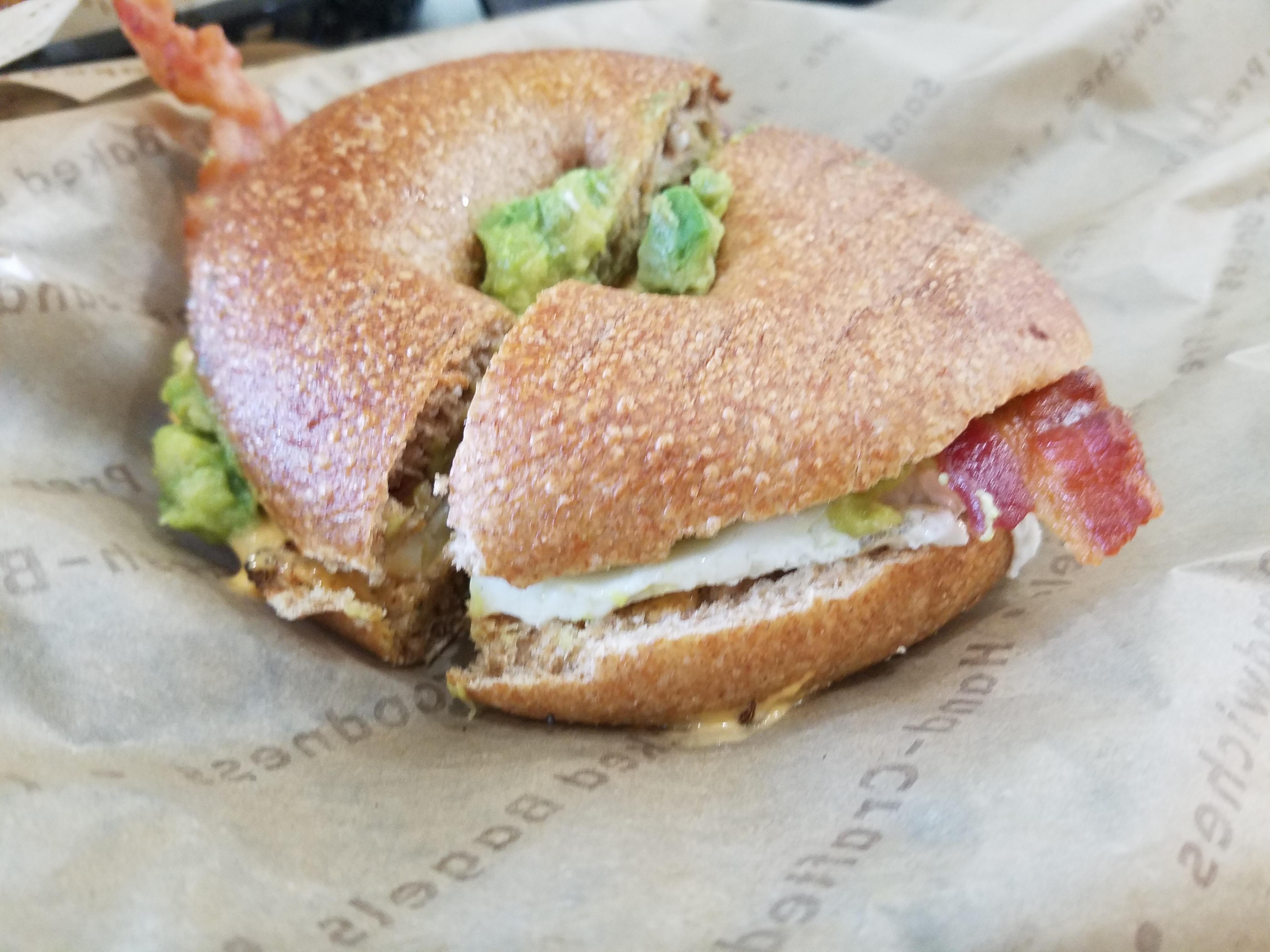 Bacon, egg, cream cheese and avocado bagel at Noah's Bagels this