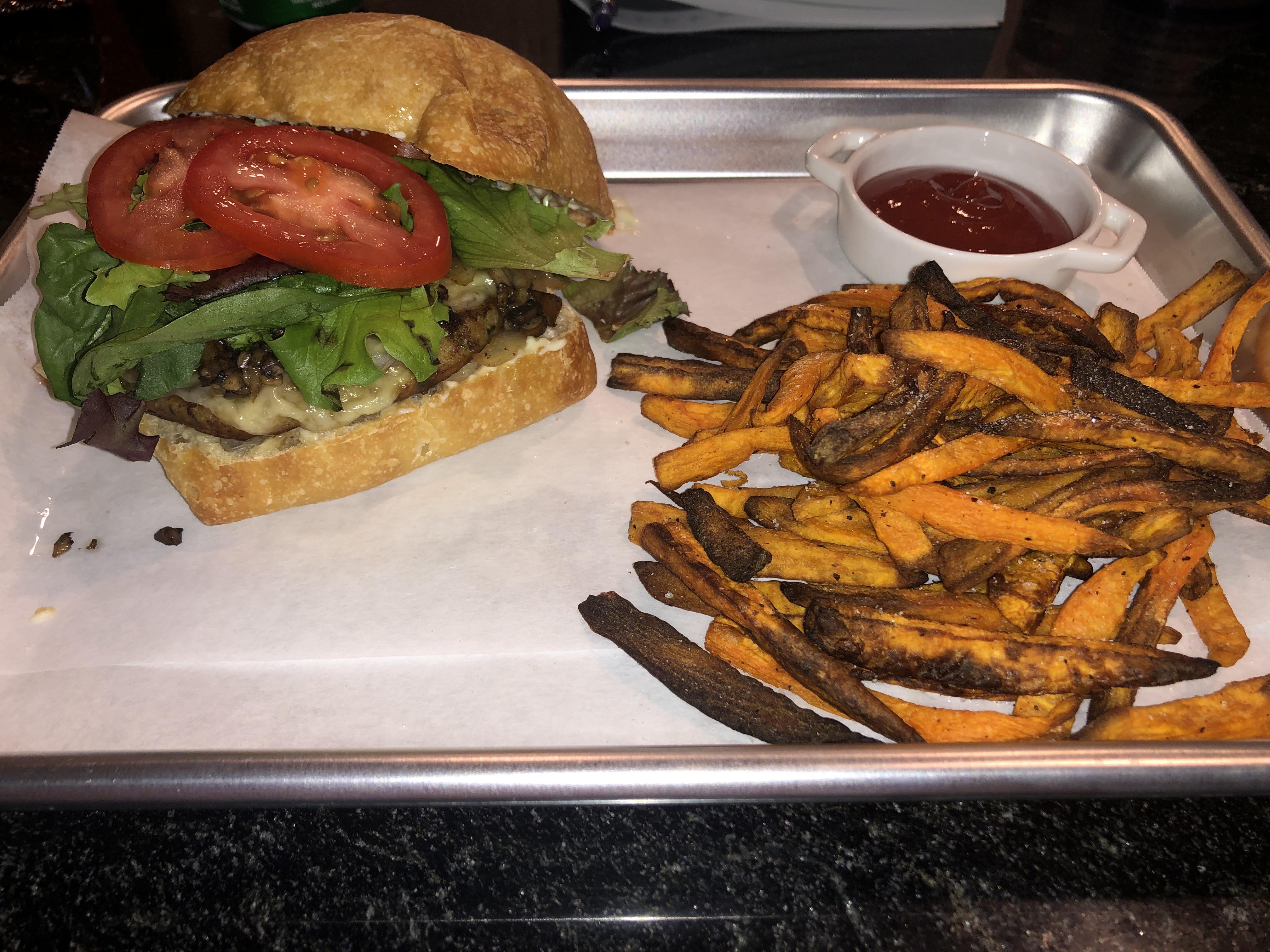 Chicken and kale burger, with grilled onions and mushrooms, toasted