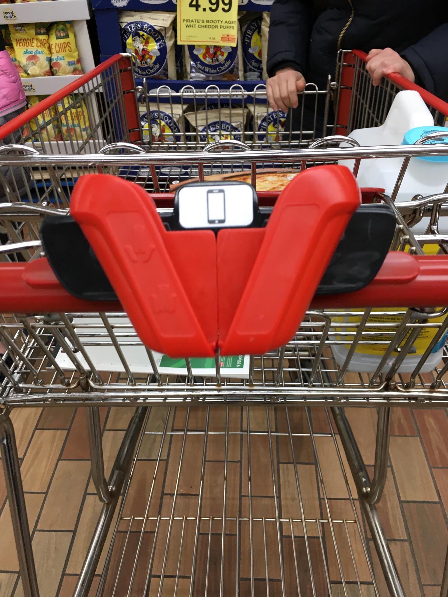 These shopping carts have holders to put your phone in so you can check
