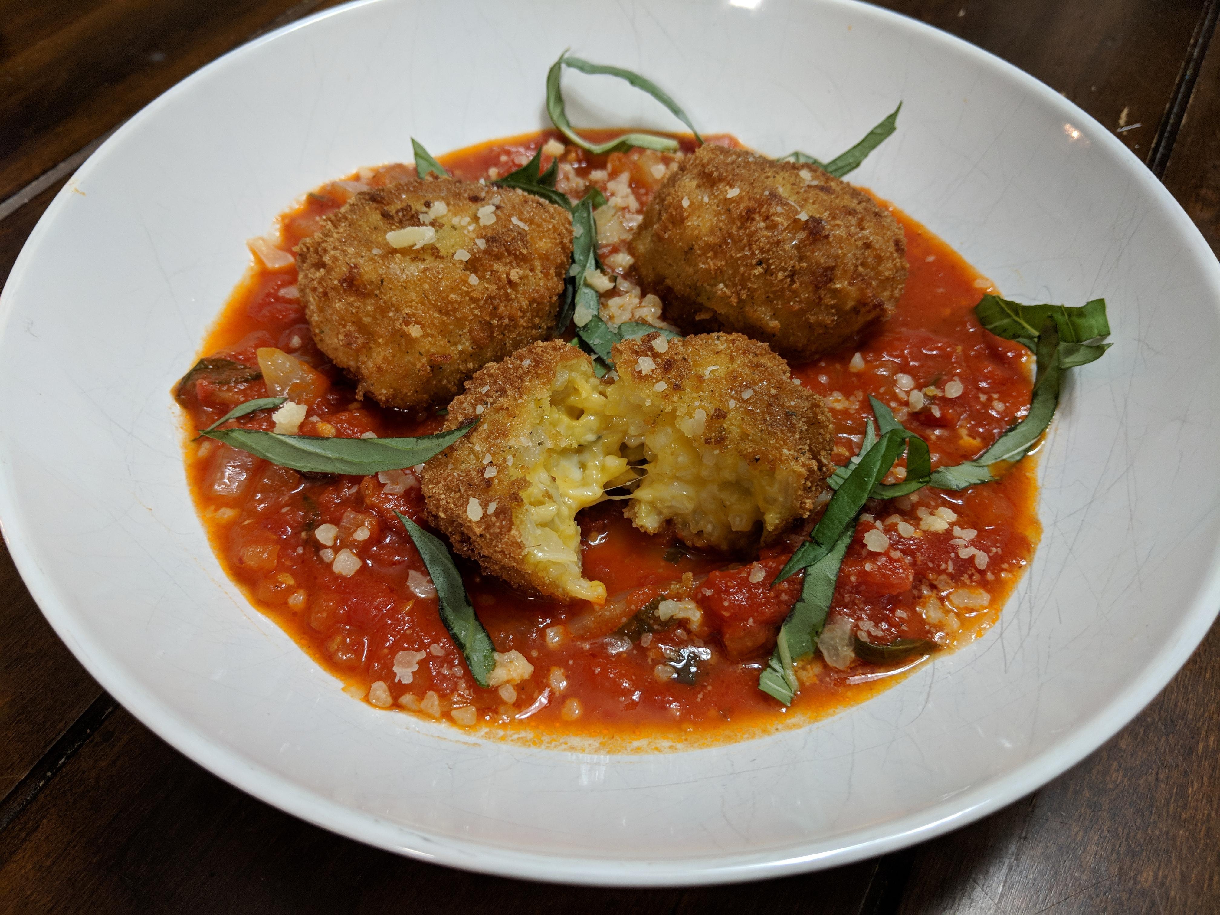 Gluten free cheesy risotto balls with homemade marinara. Craving cured