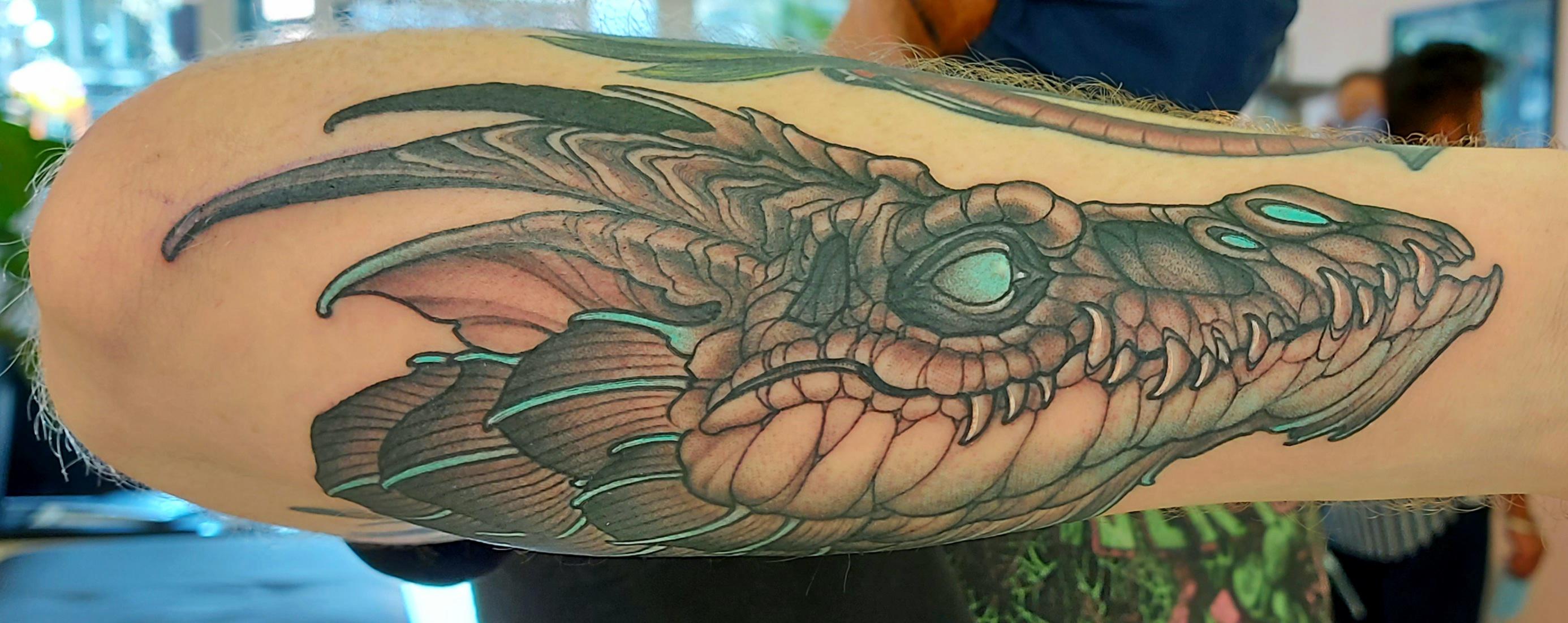 Bioluminescent dragon by Miles Kanne, Tech Noir tattoo, Victoria BC