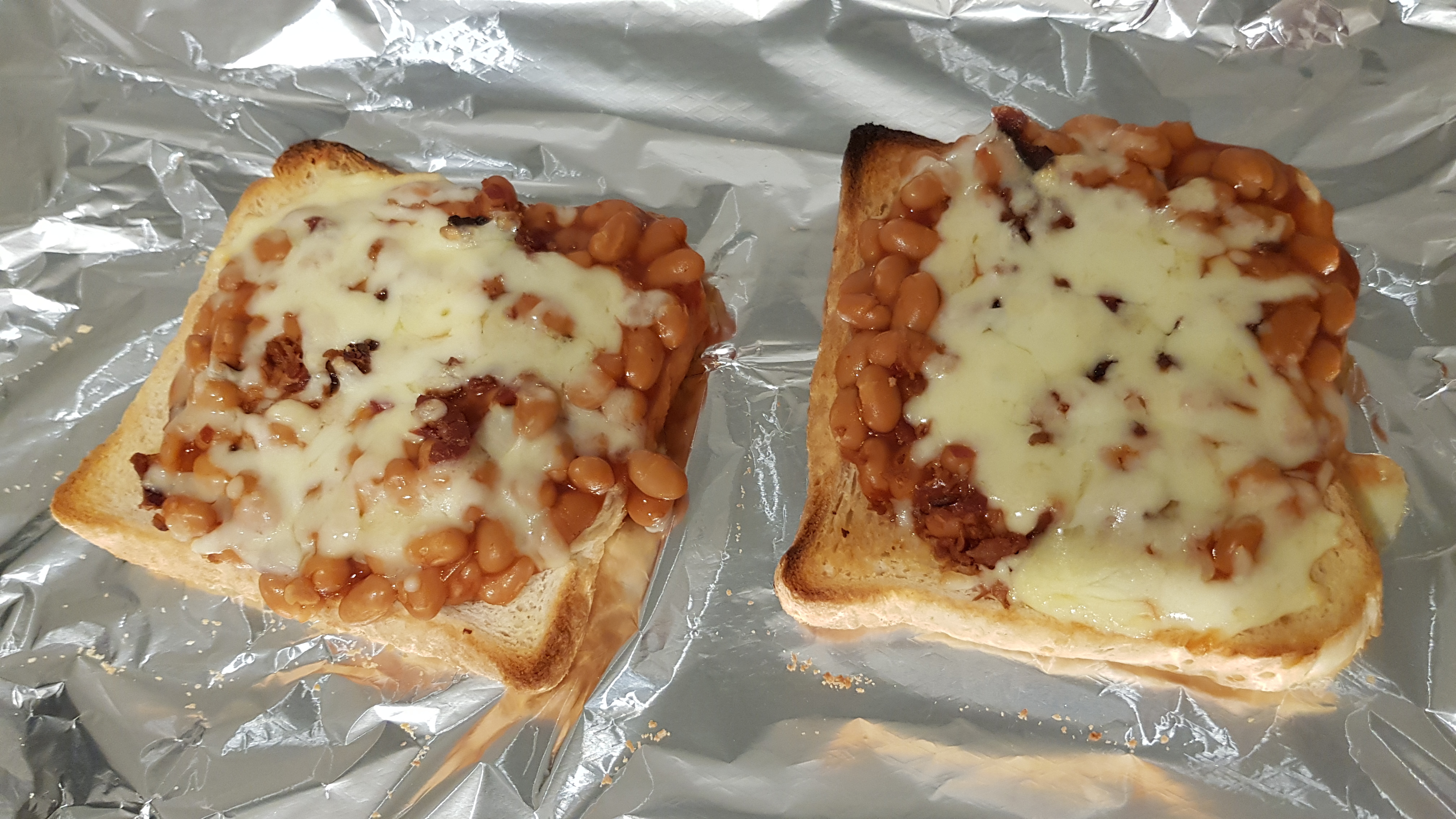 Gourmet Australian meal. Baked beans on toast with bacon bits and