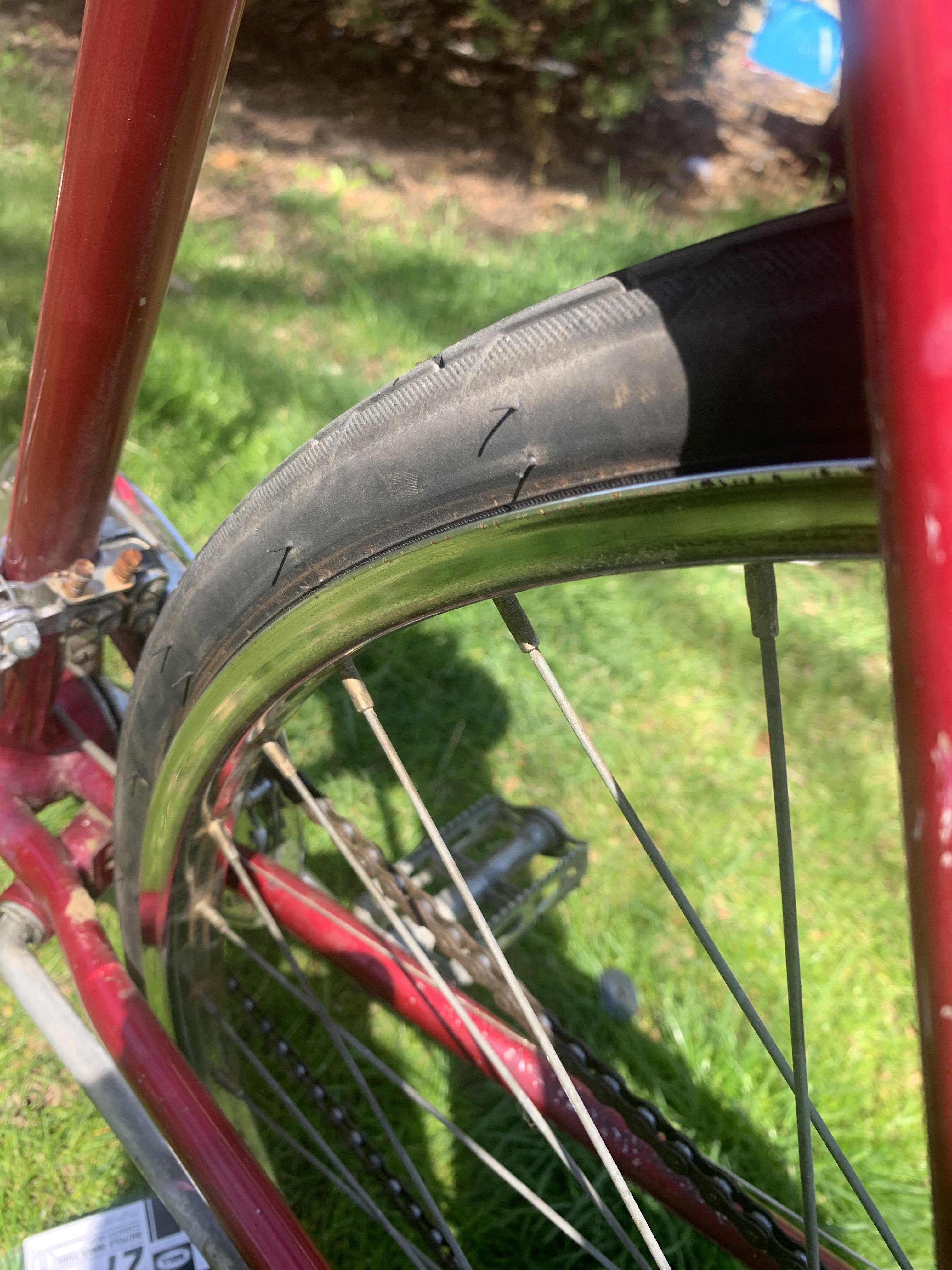 Is this normal? It looks like the bike tire is coming off the rim, just
