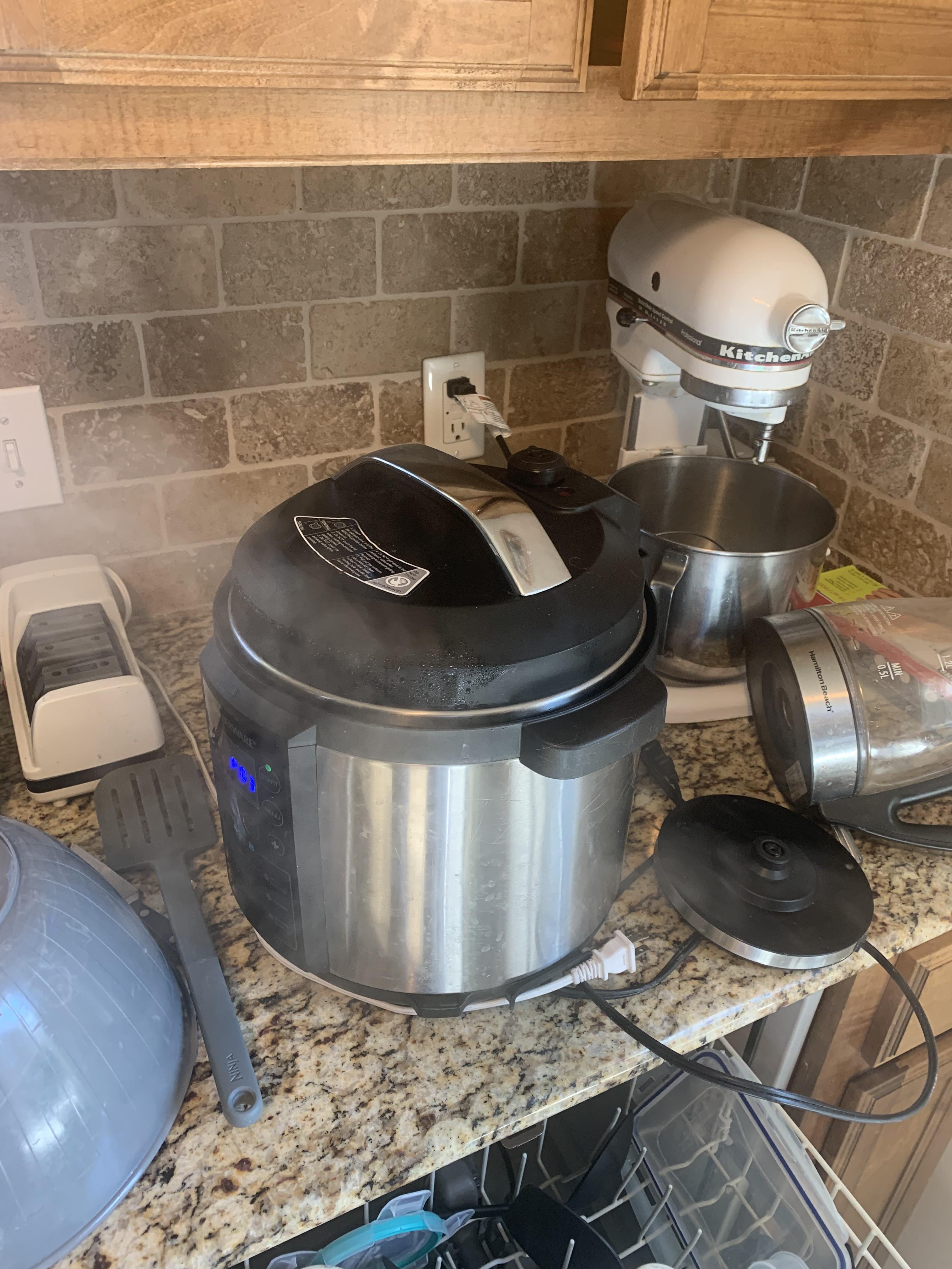 My pressure cooker has steam escaping from the sides here. How can I