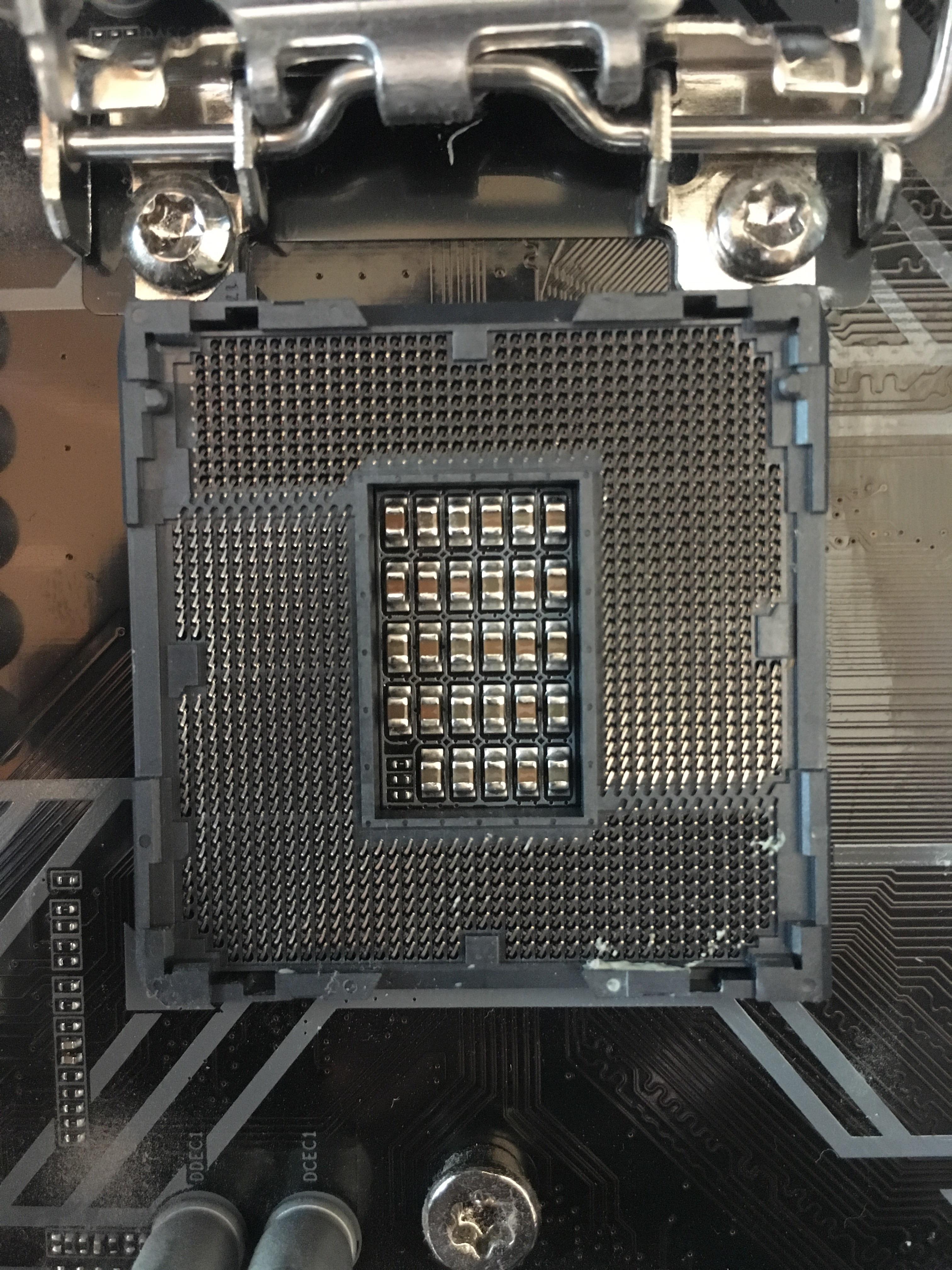 Thermal paste in cpu socket and pin possibly bent. Please help, the pc