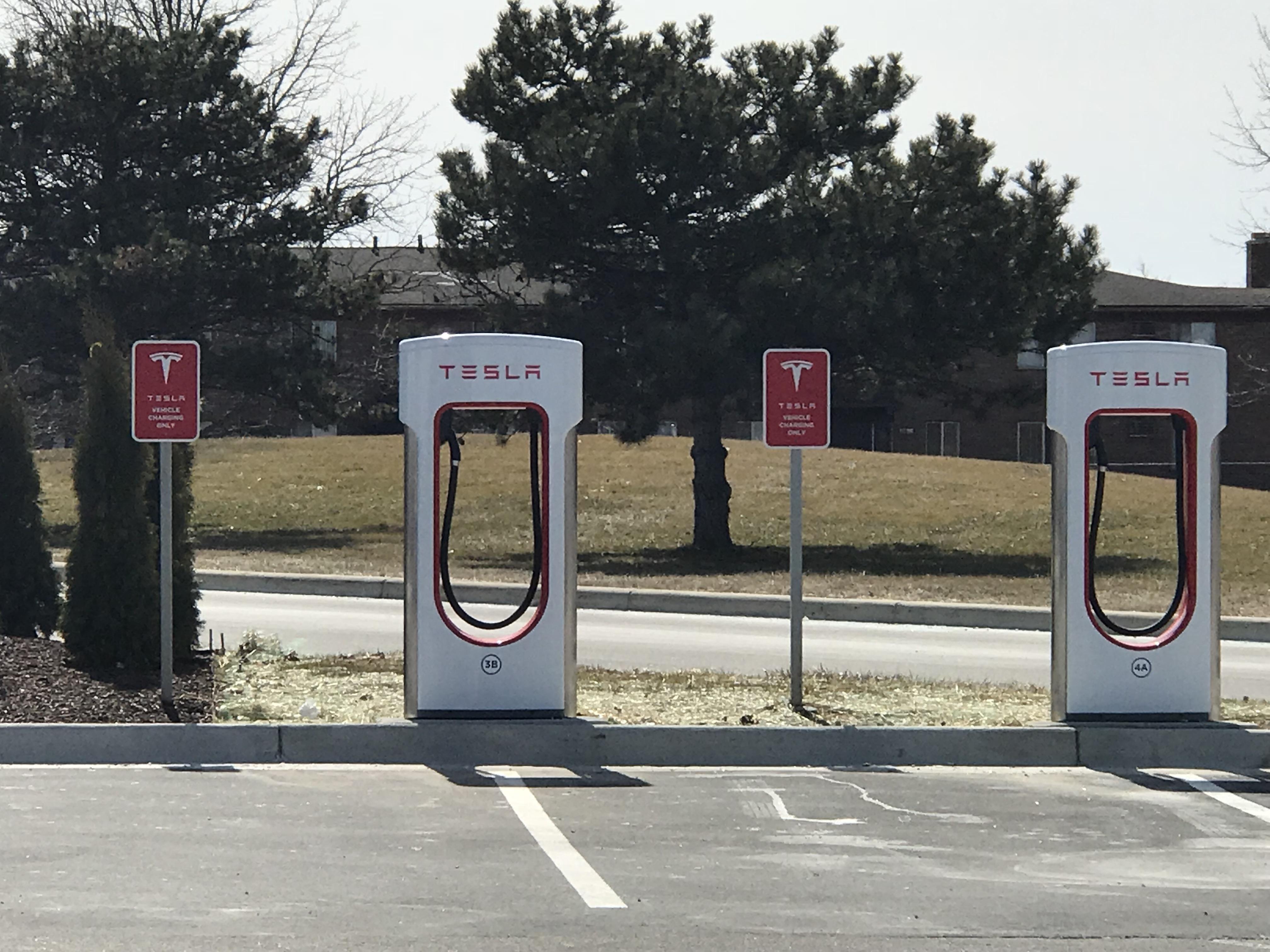 Tesla charging station at my local grocery store. r/pics