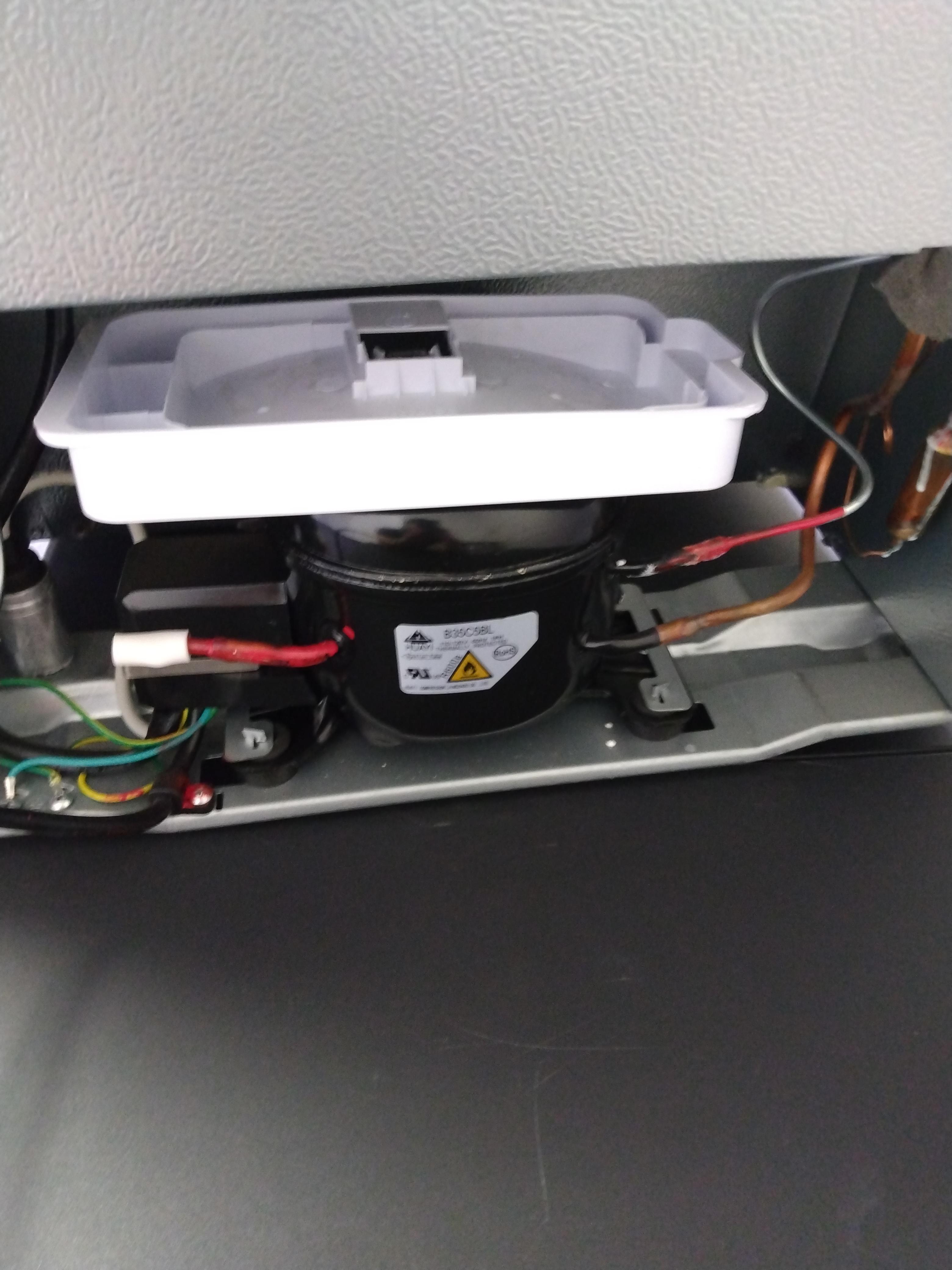 What is this plastic thing (on the back of Galanz mini fridge)? Do I