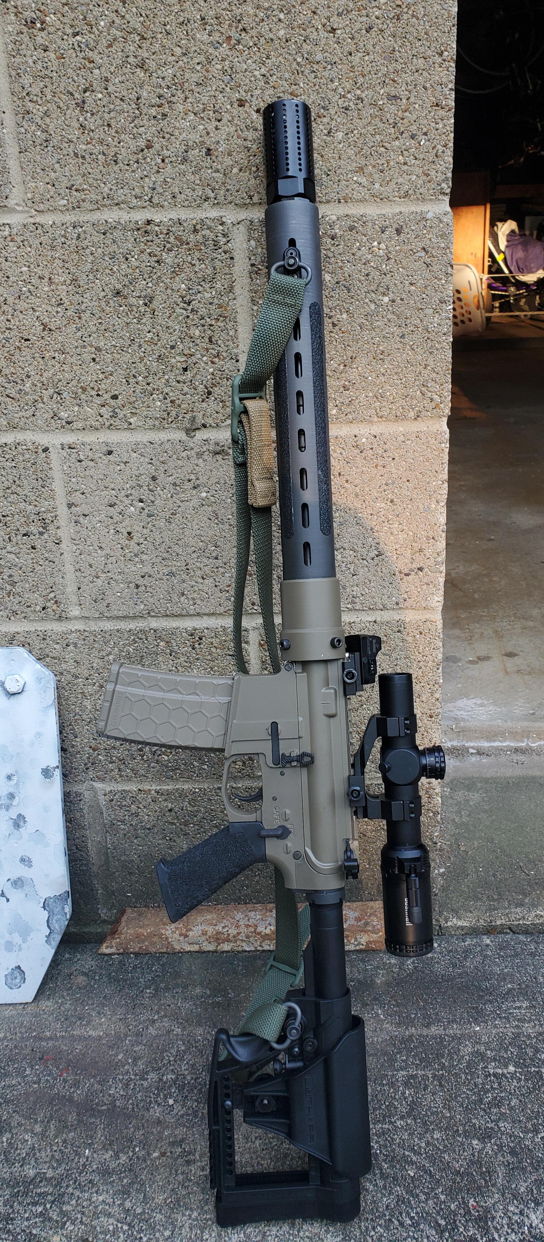 Another of my ARs. 80 lower and a homemade carbon fiber handguard r/ar15