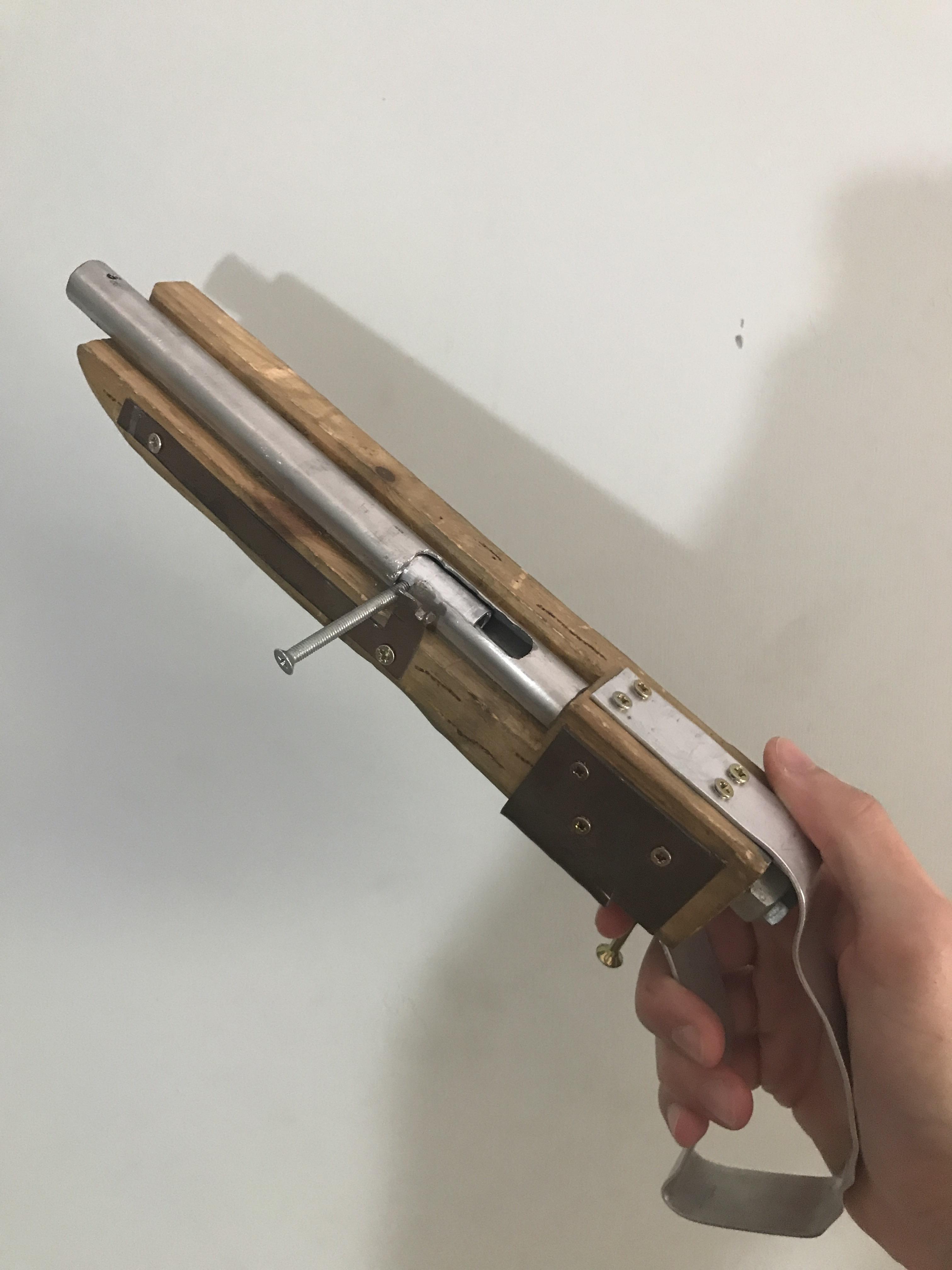 A bolt action pipe pistol i made with some metal scraps and wood, it