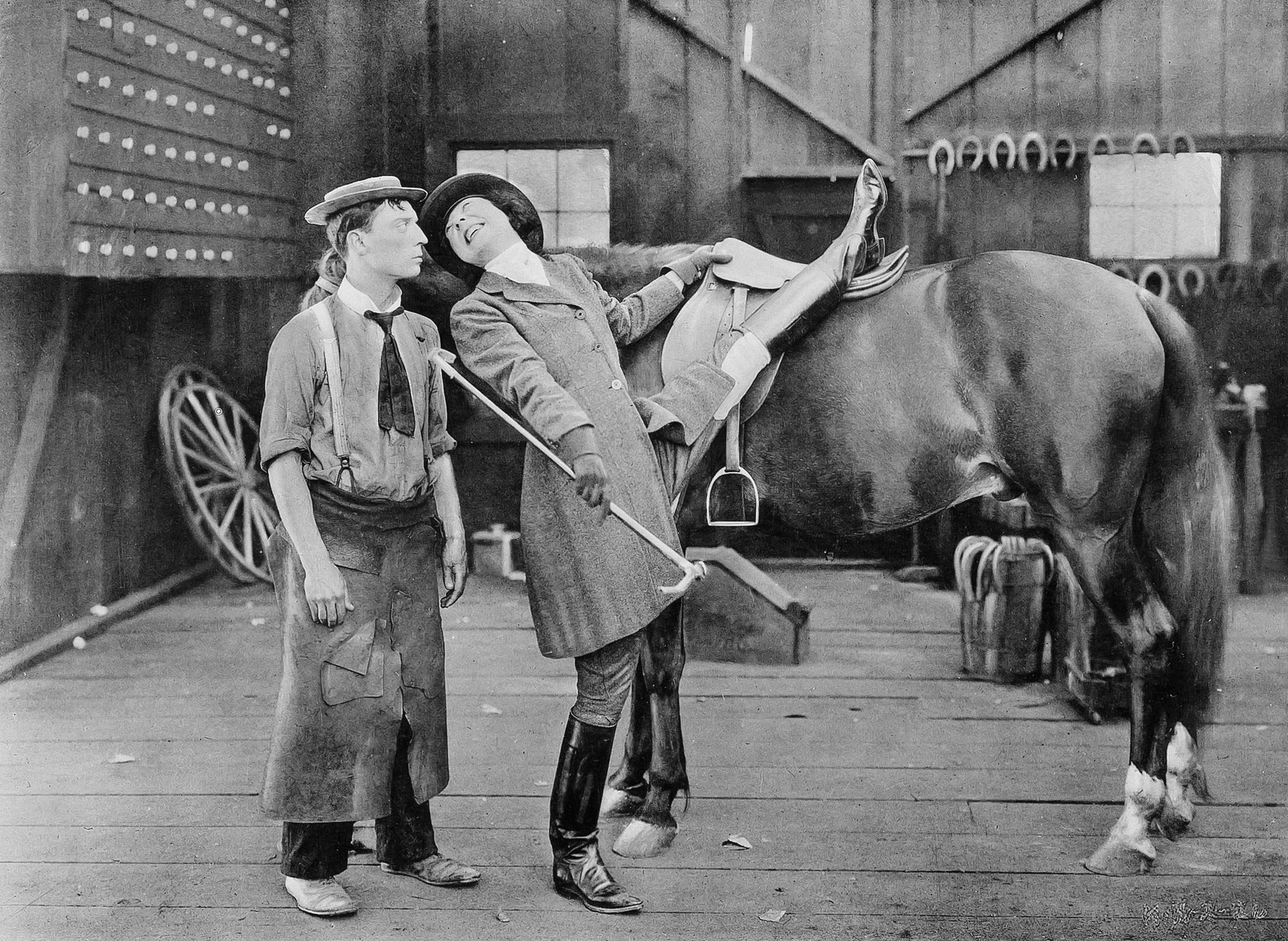Buster Keaton seems less than impressed with this horsewoman’s ability