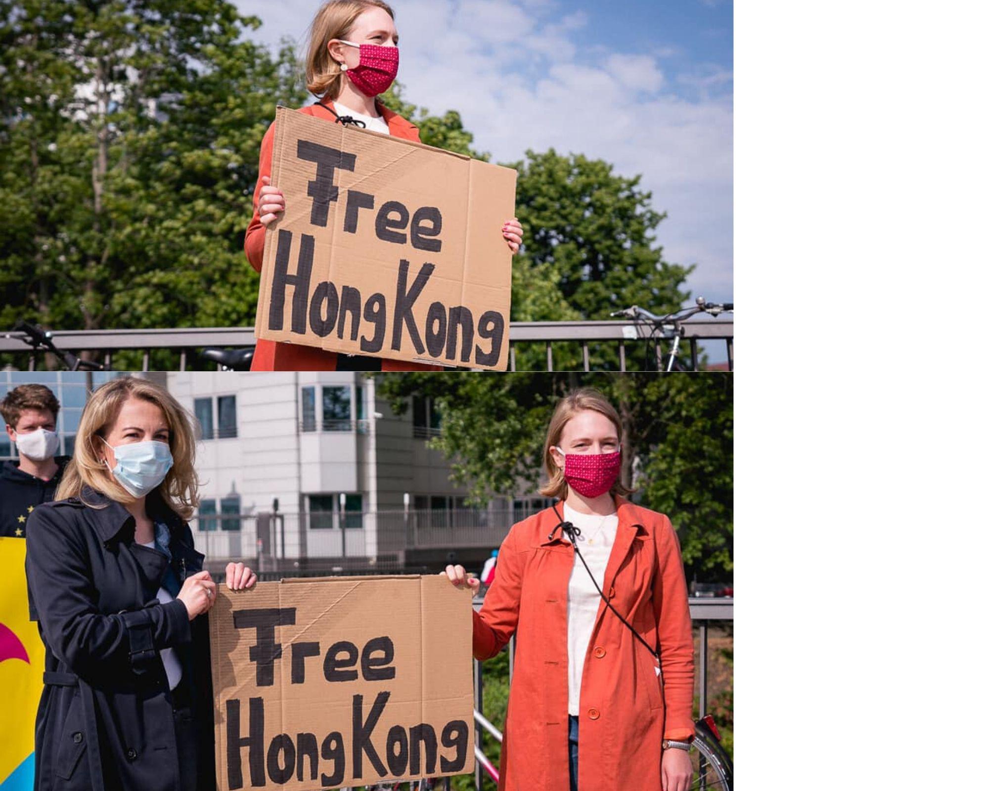 Germans holding up "Free Hong Kong" signs in front of Chinese embassy in Germany neoliberal