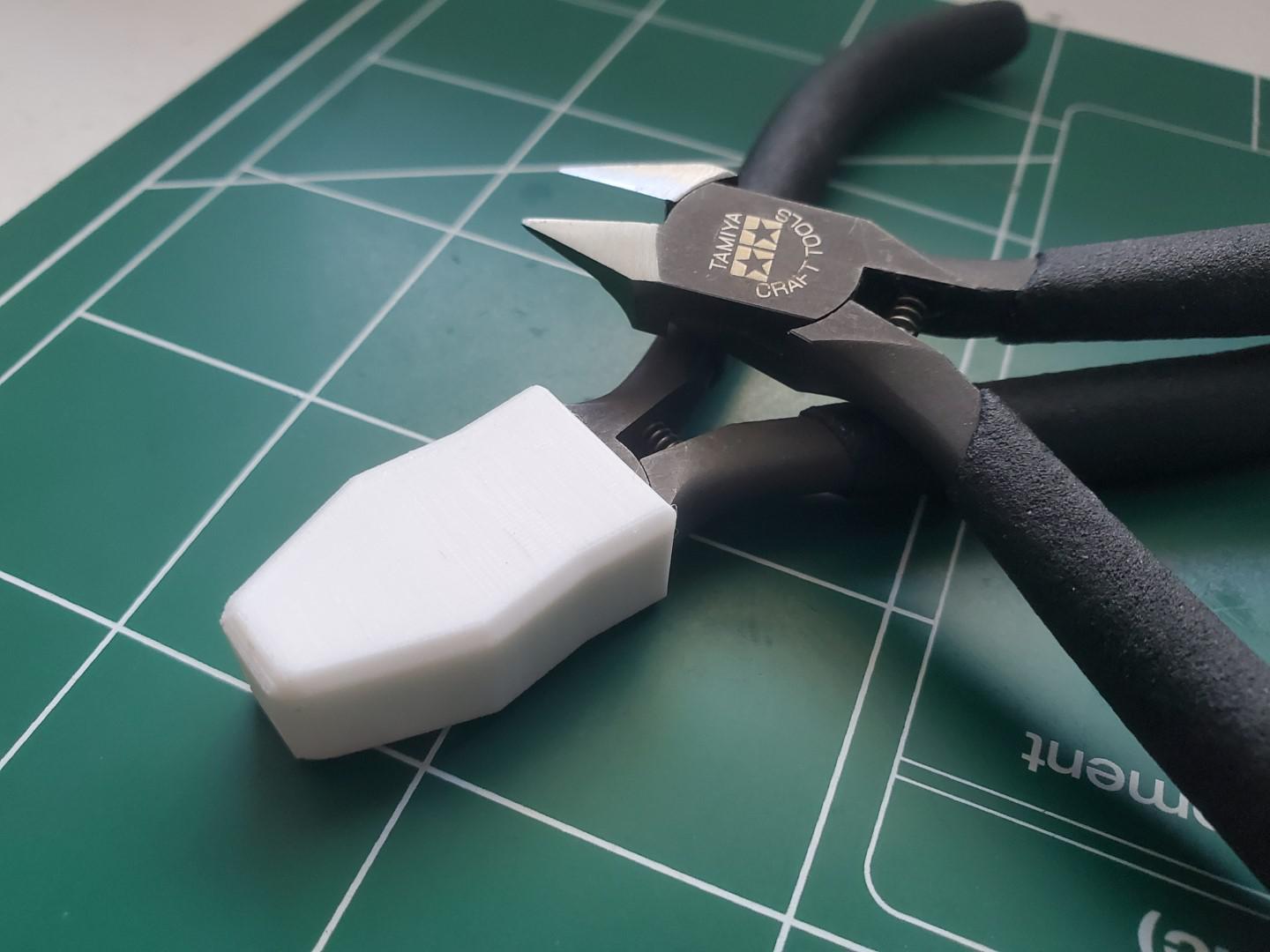 I modeled and 3D printed a sheath for the Tamiya Sharp Pointed Side