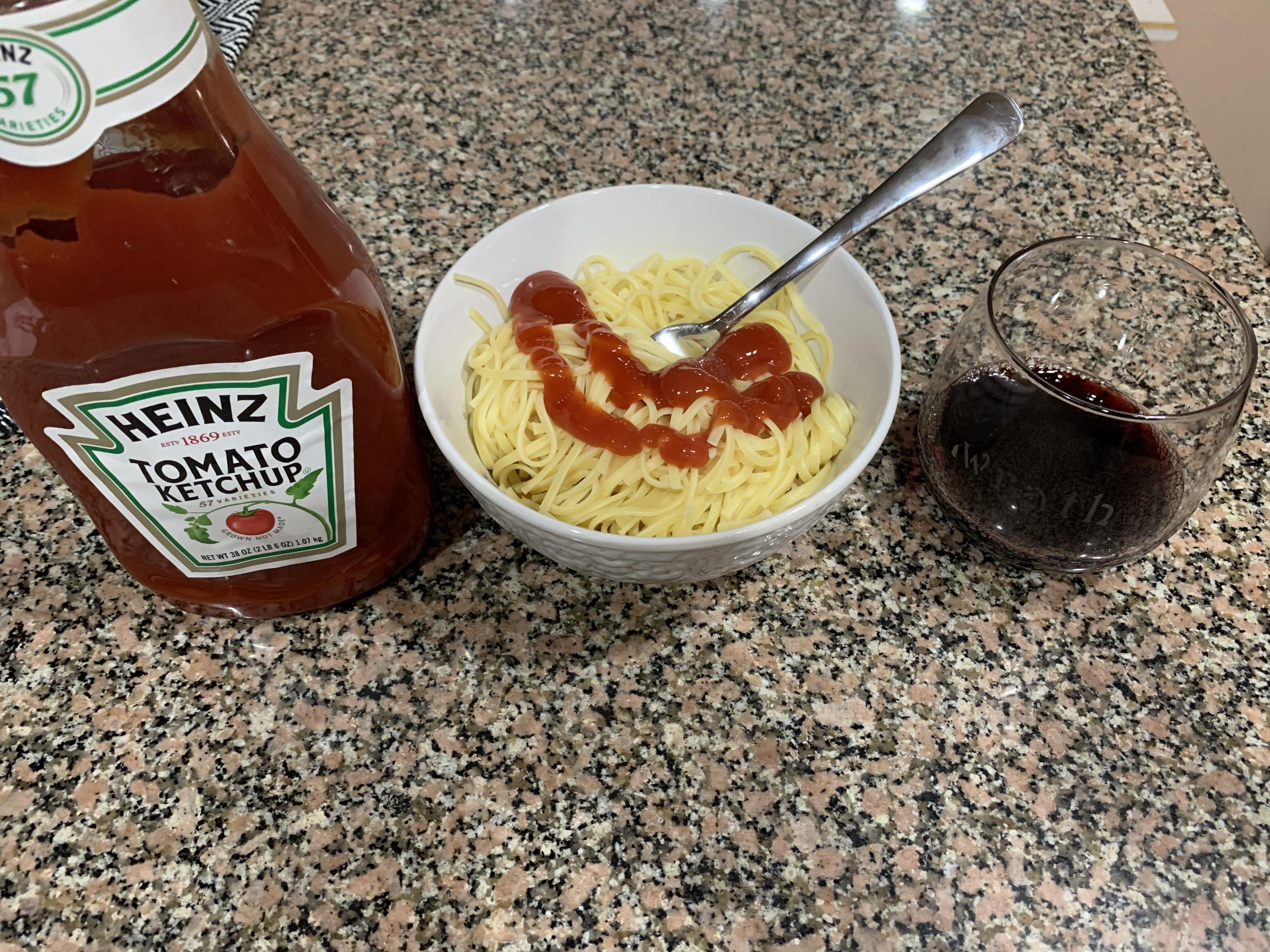 Spaghetti and ketchup with some red wine to wash it down. r