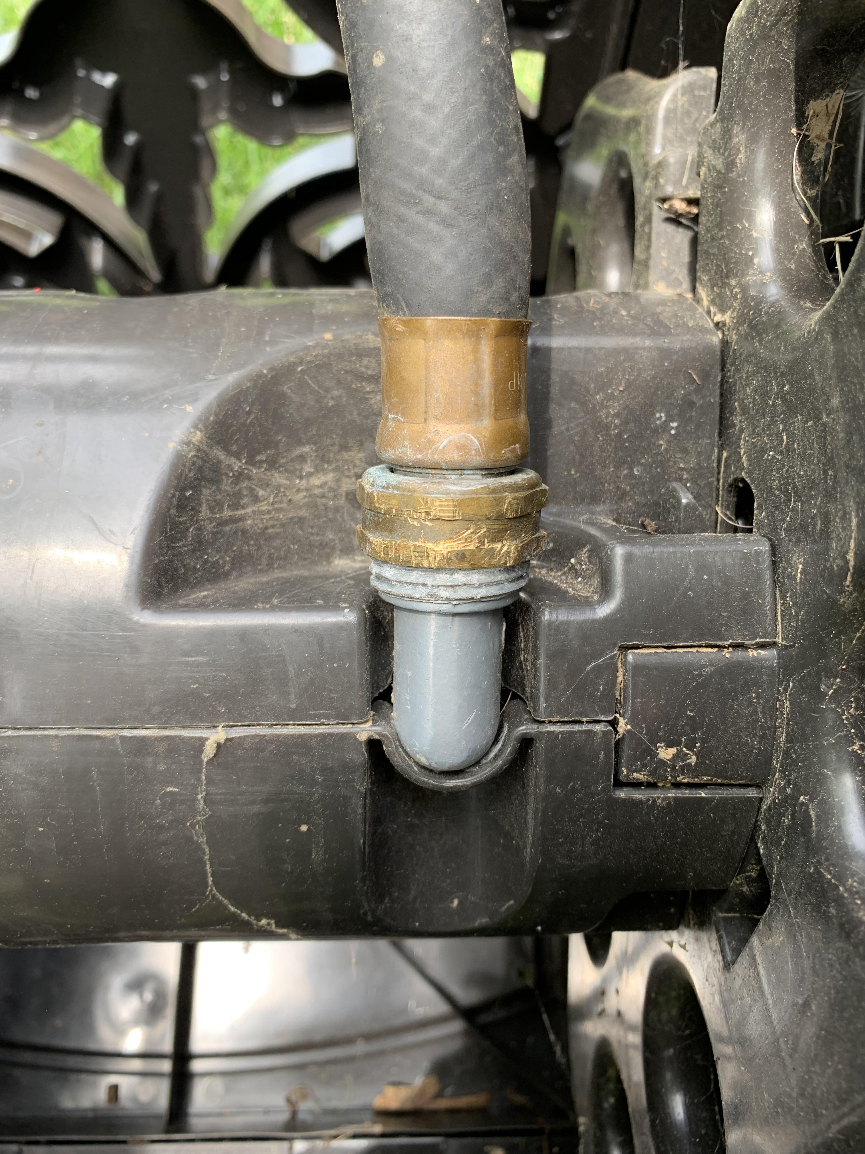 How can I unscrew the stuck hose from the hose reel? It won’t budge and