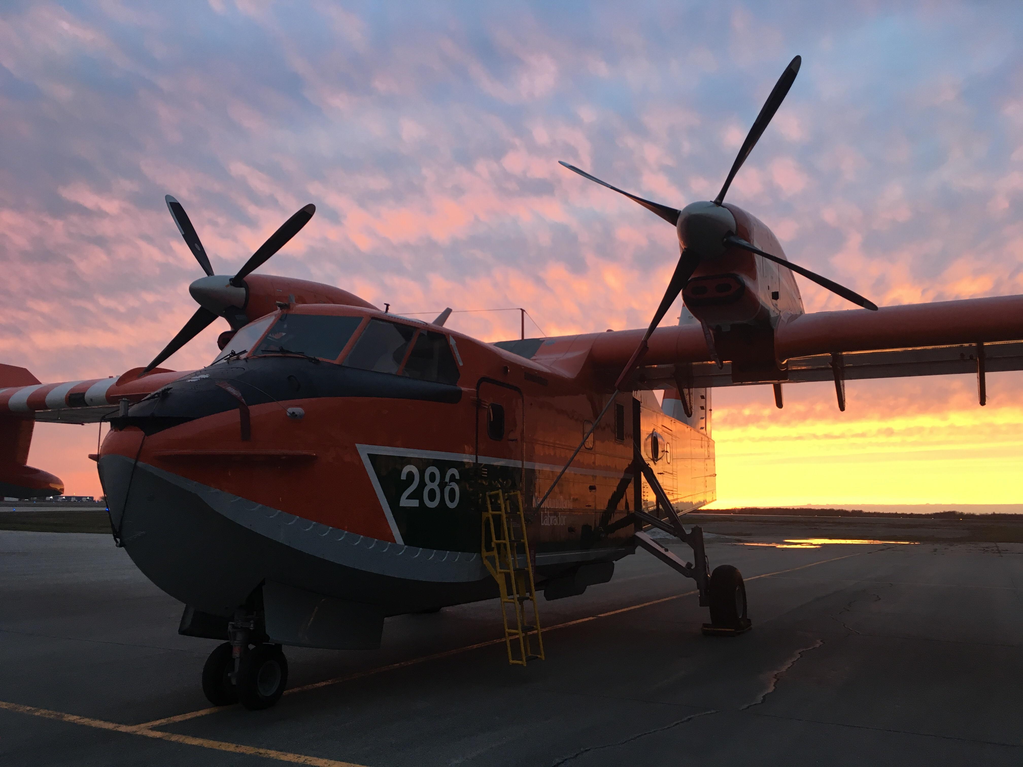 Sunset behind a Bombardier Canadair CL415 water bomber at CYQX. r