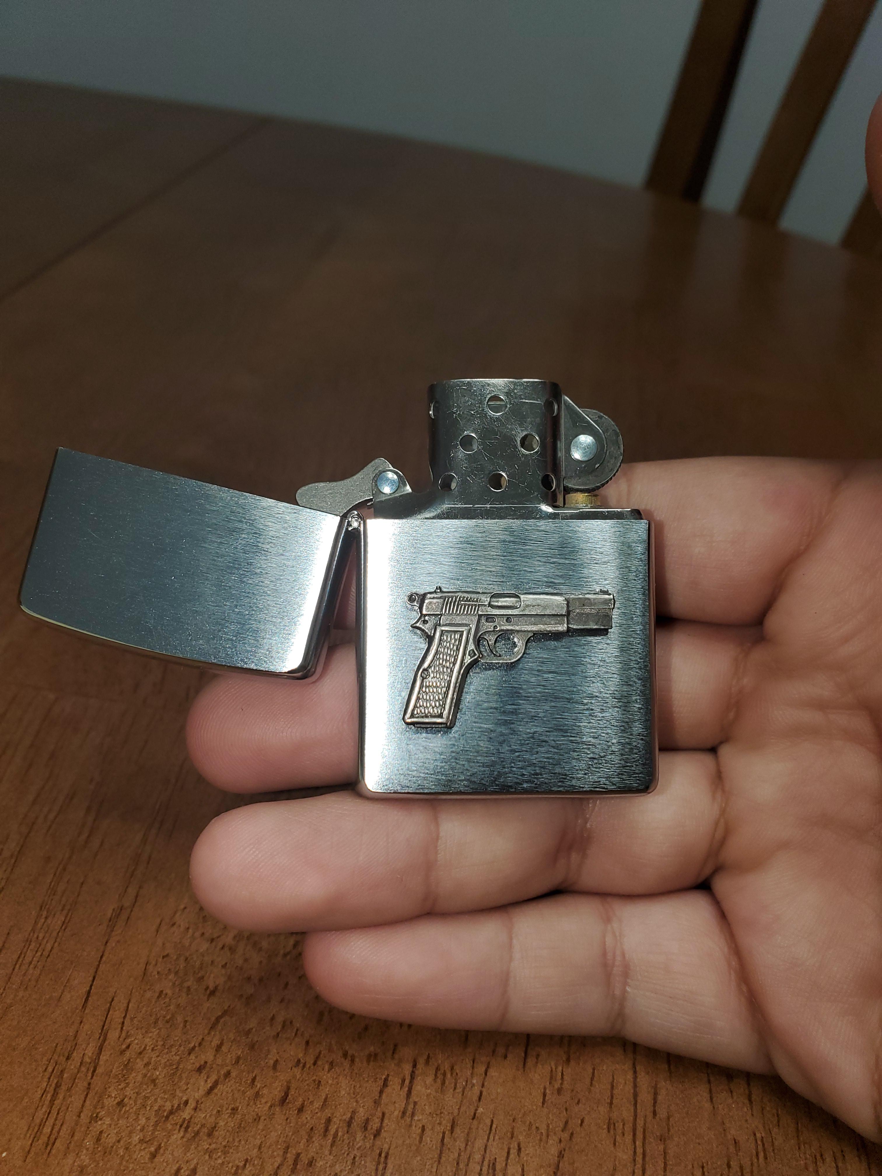 Does anyone know anything about this zippo with a hi power pistol on it all I know is that it