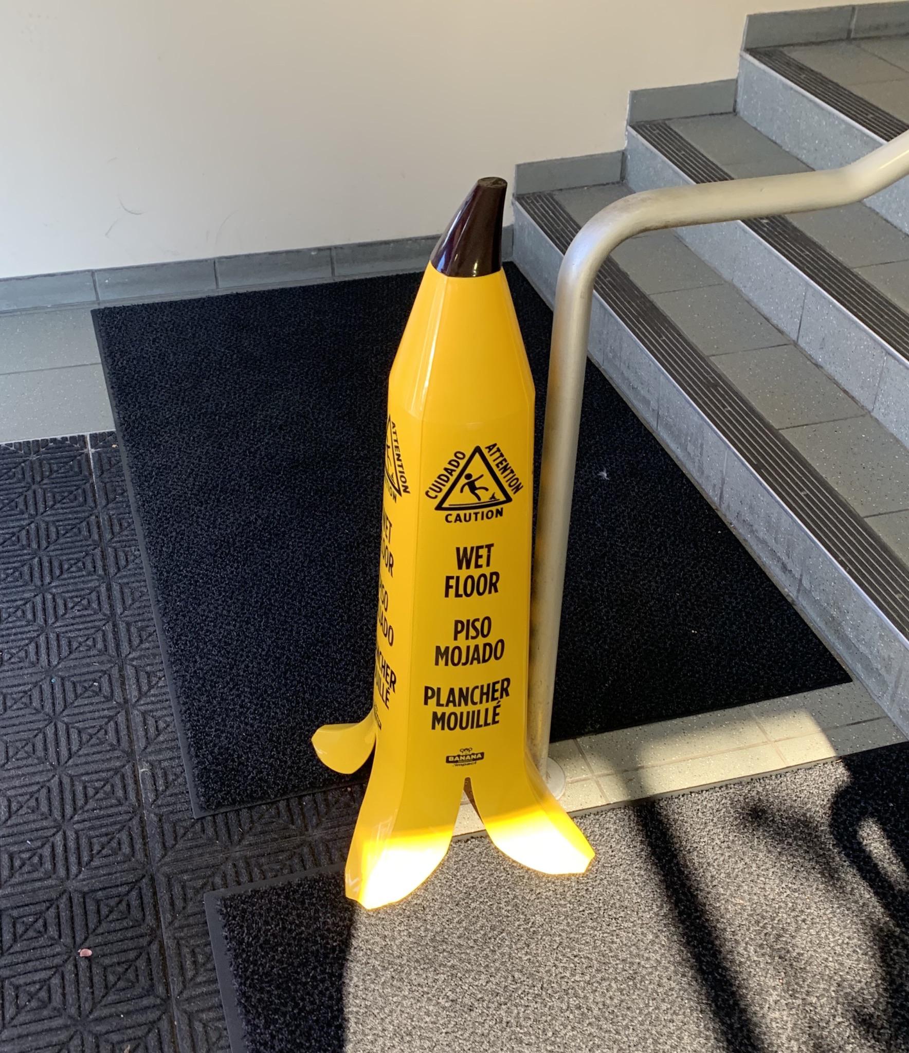 This “slippery floor” sign is shaped like a banana. mildlyinteresting