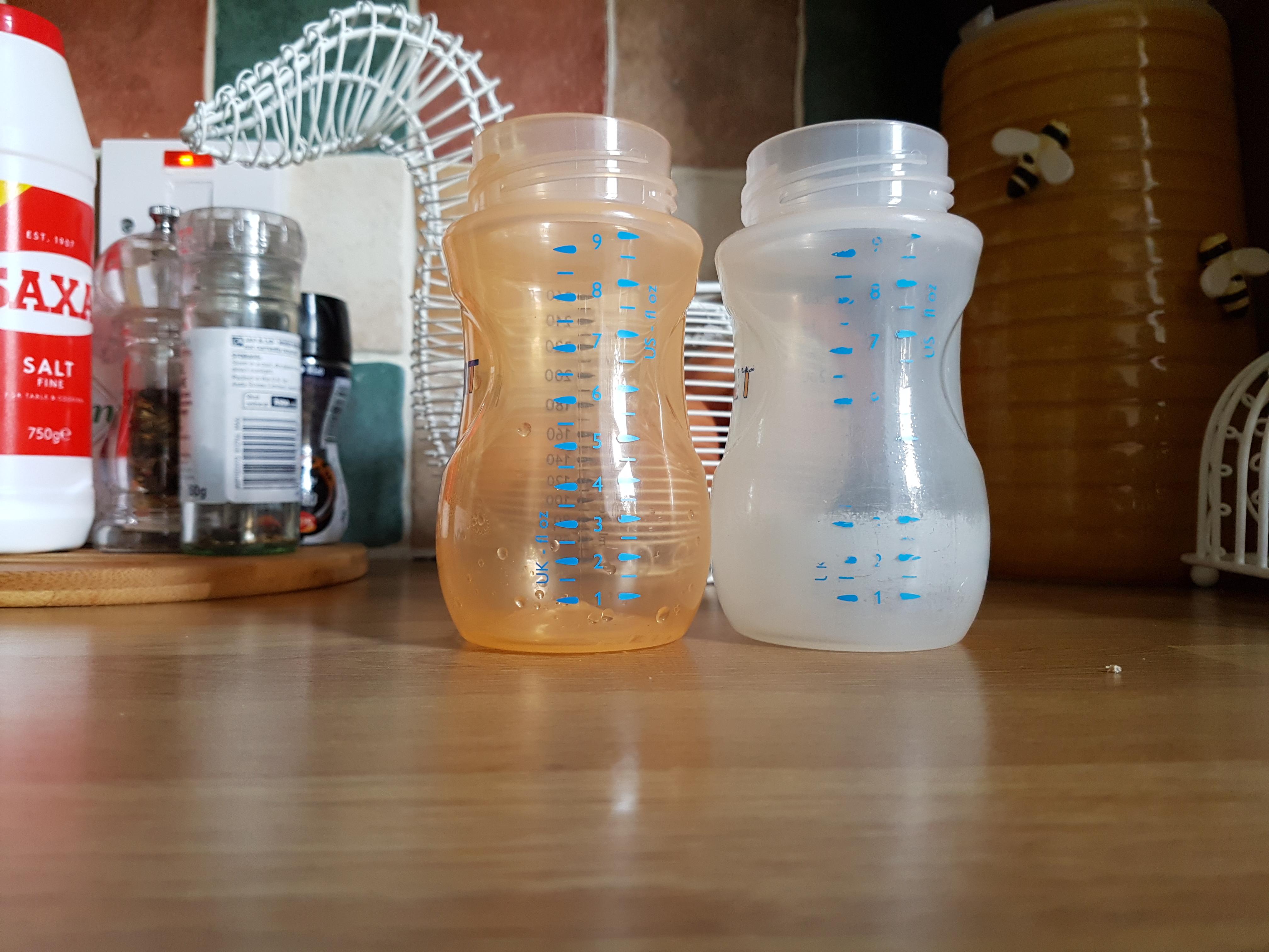 2 baby bottles 2 years old one L washed regularly in London, R washed