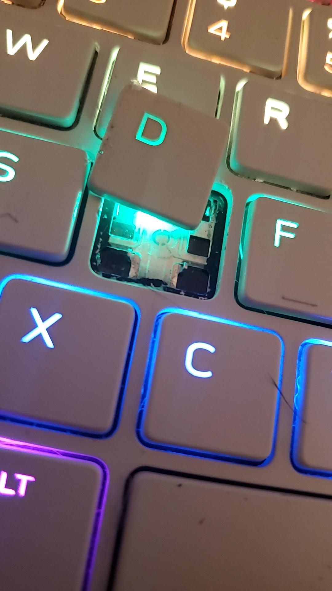 How can I reattach this key? The top right prong that snaps it in place