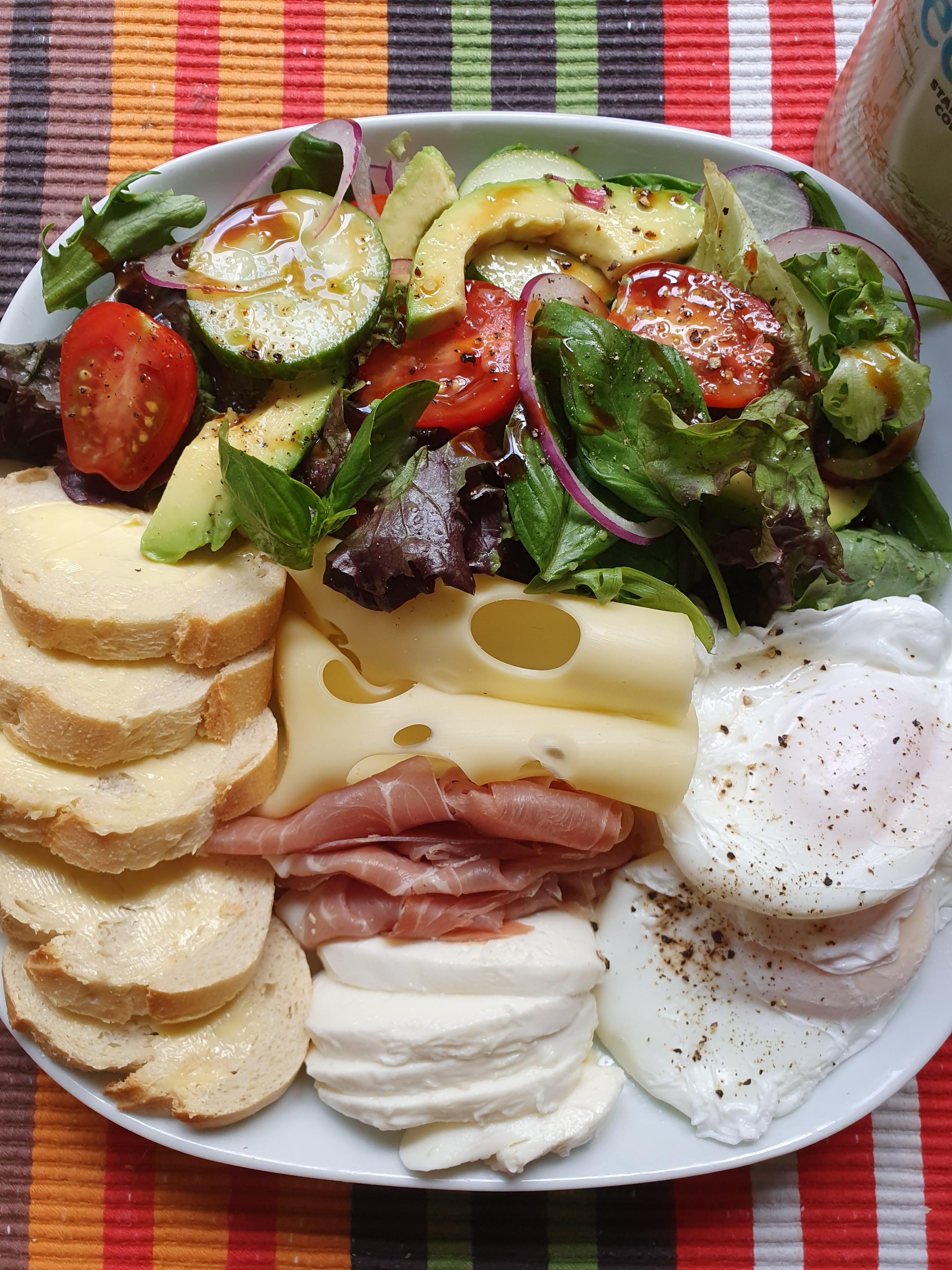 [I ate] Sliced baguette with tomatoes, onion, mixed leaf lettuce, basil