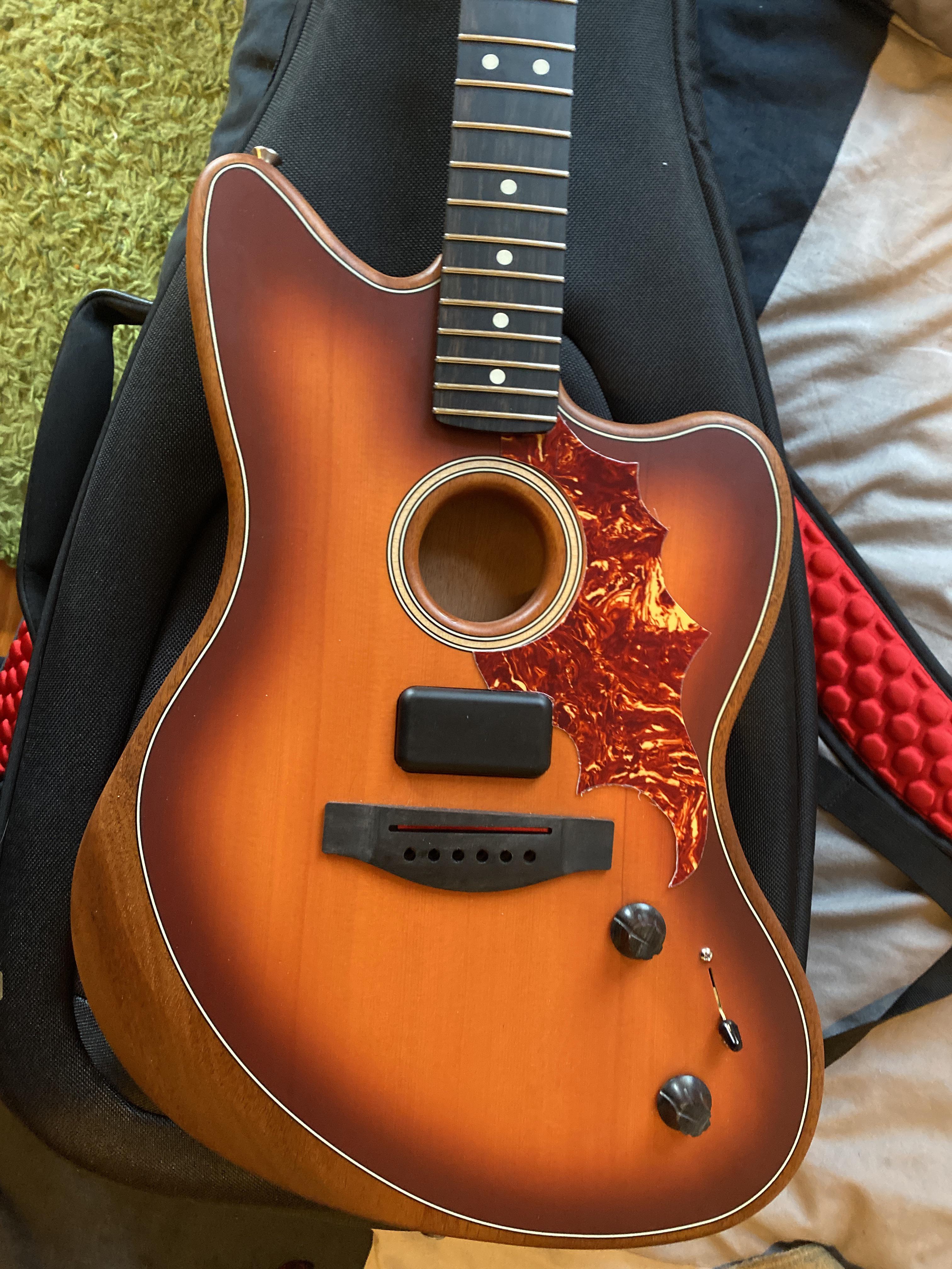 Acoustasonic Jazzmaster came without a pickguard and the sound hole is