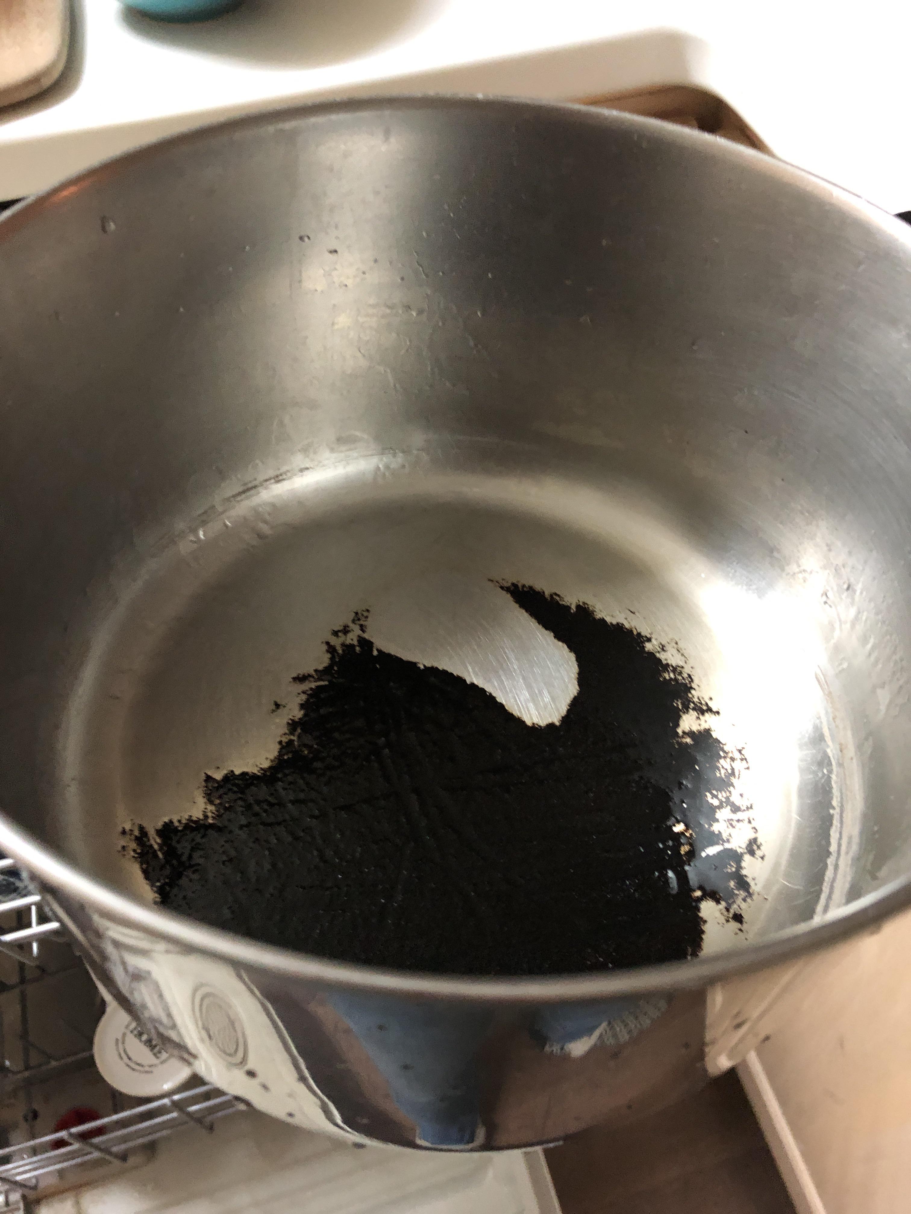 How can I clean this pan? I’ve tried boiling water with baking soda