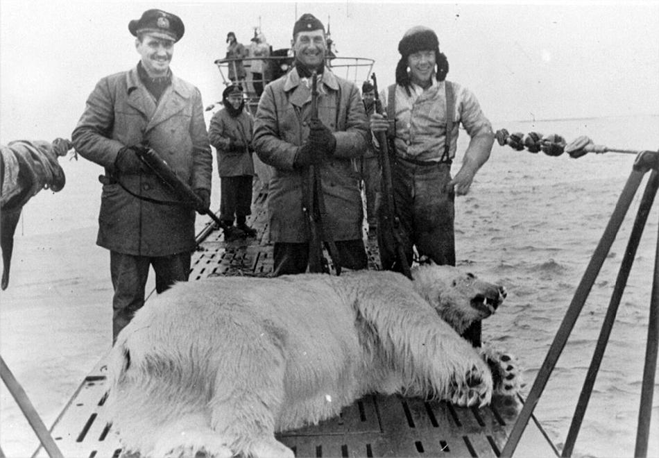 Crew of German submarine U537 pose with a polar bear killed while