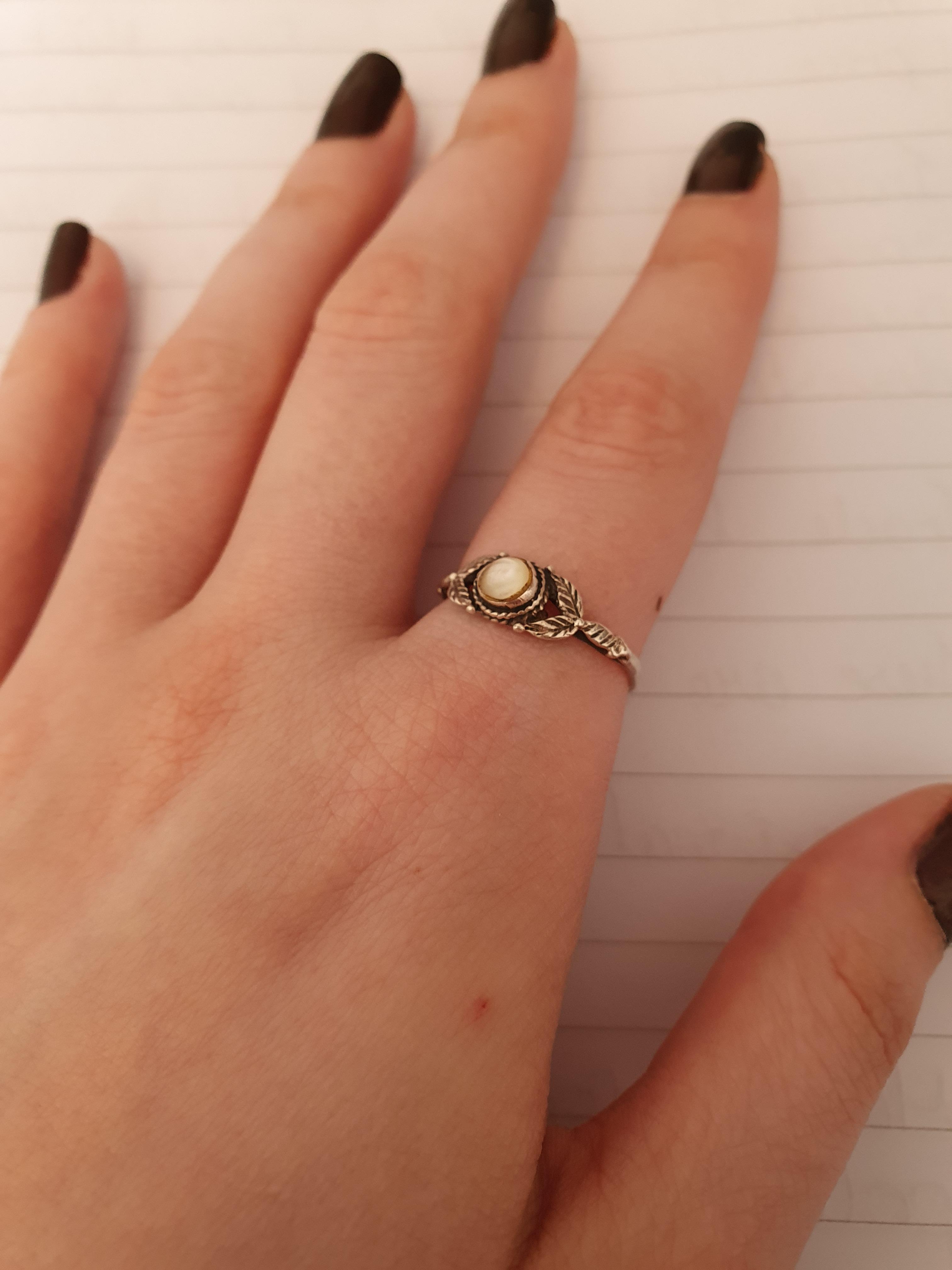 Little ring I got given when I was about 10. Pretty sure it's an opal. r/jewelrylove
