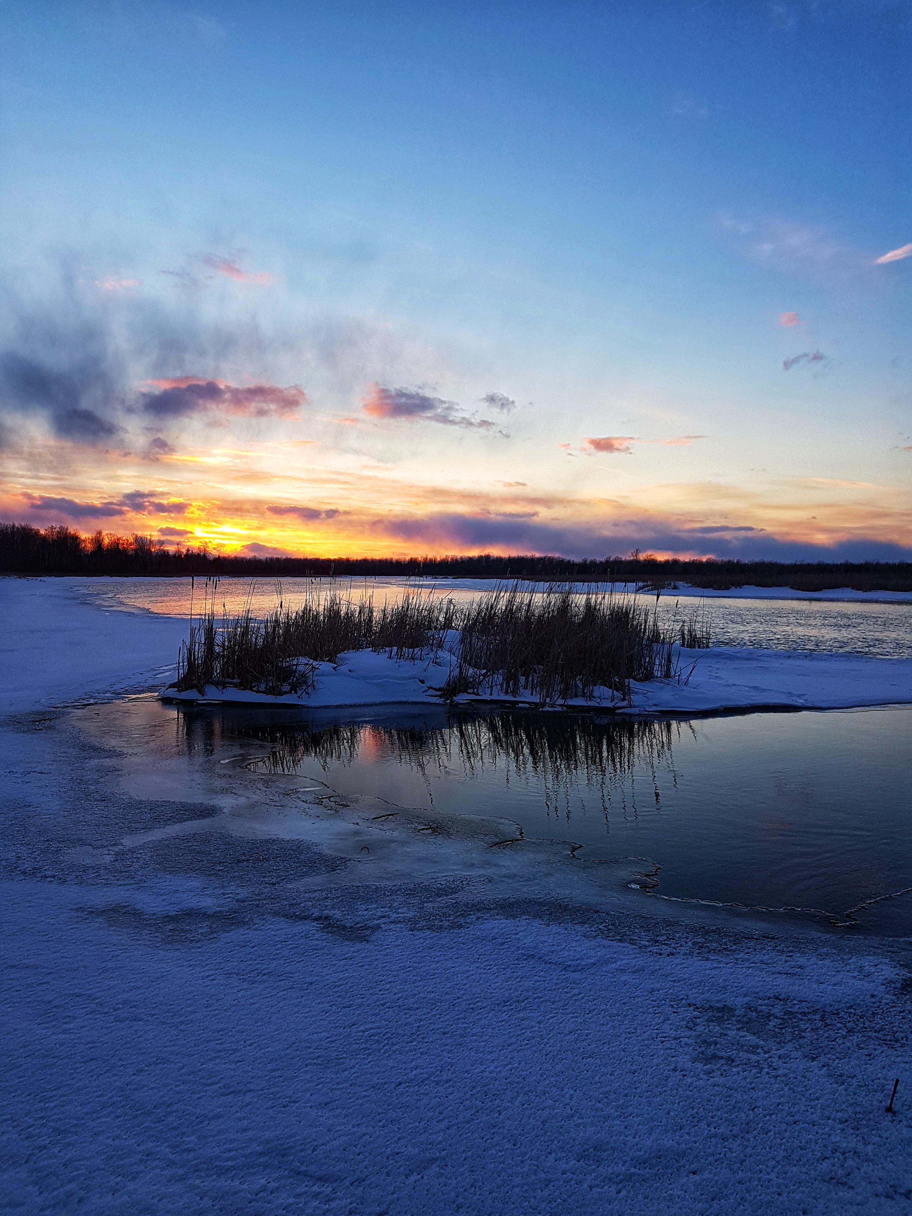 Cold weather sunset on the Rideau river in Ontario Canada [3024x4032