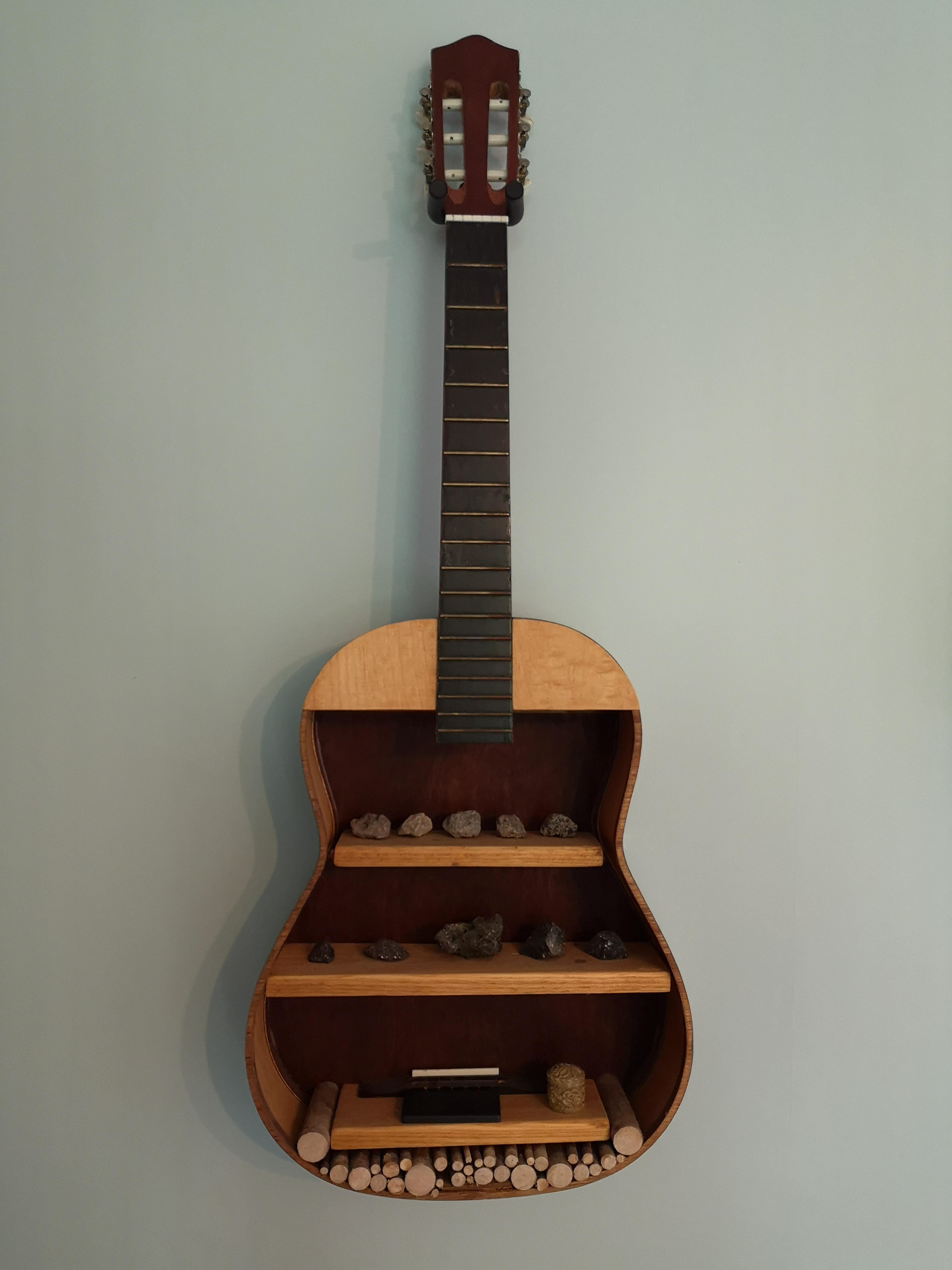 Recycled an old guitar my wife said we didn't have room for. We now
