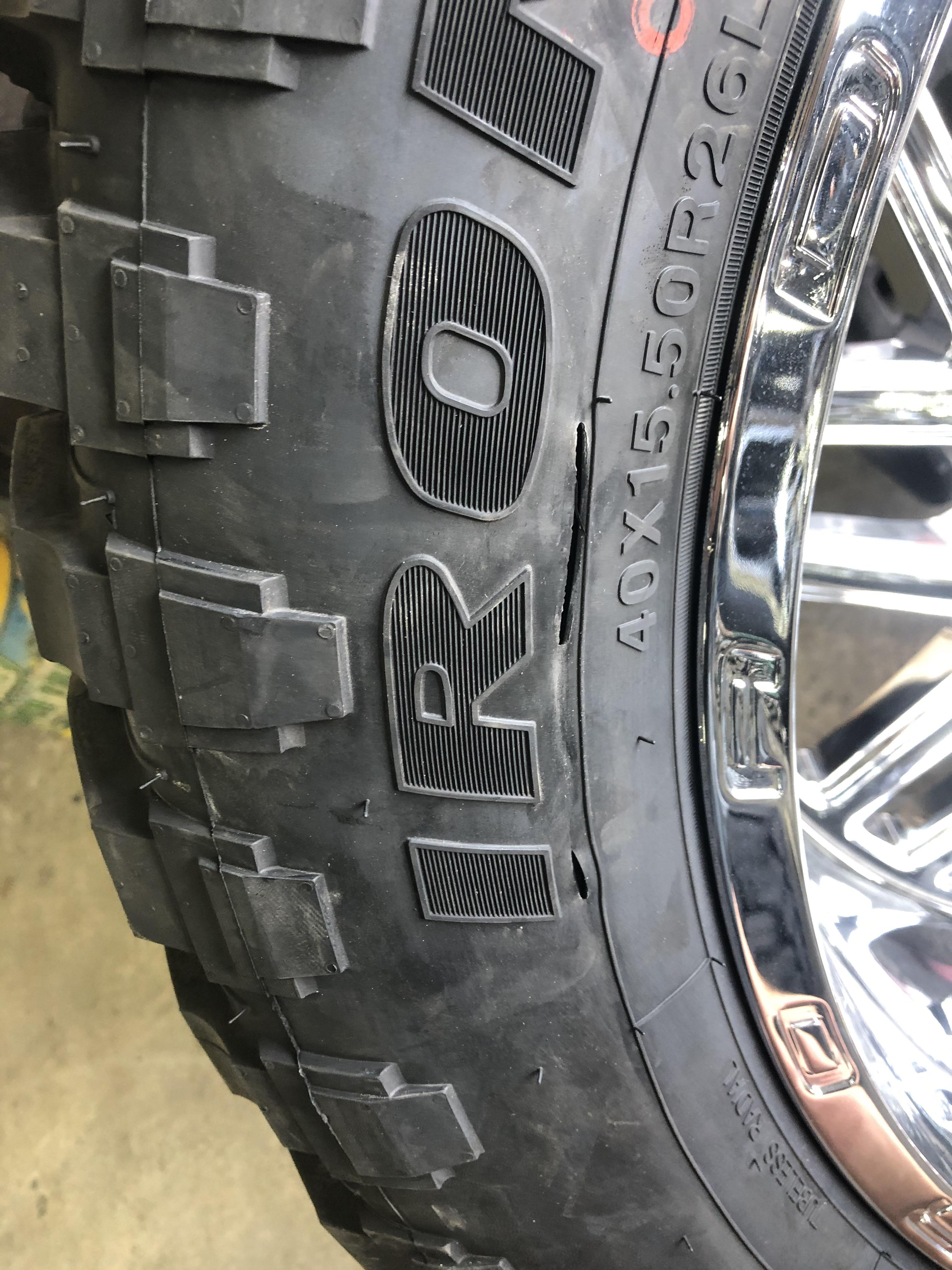 Tire tear. Tire shop mounted it and I think when they were putting the