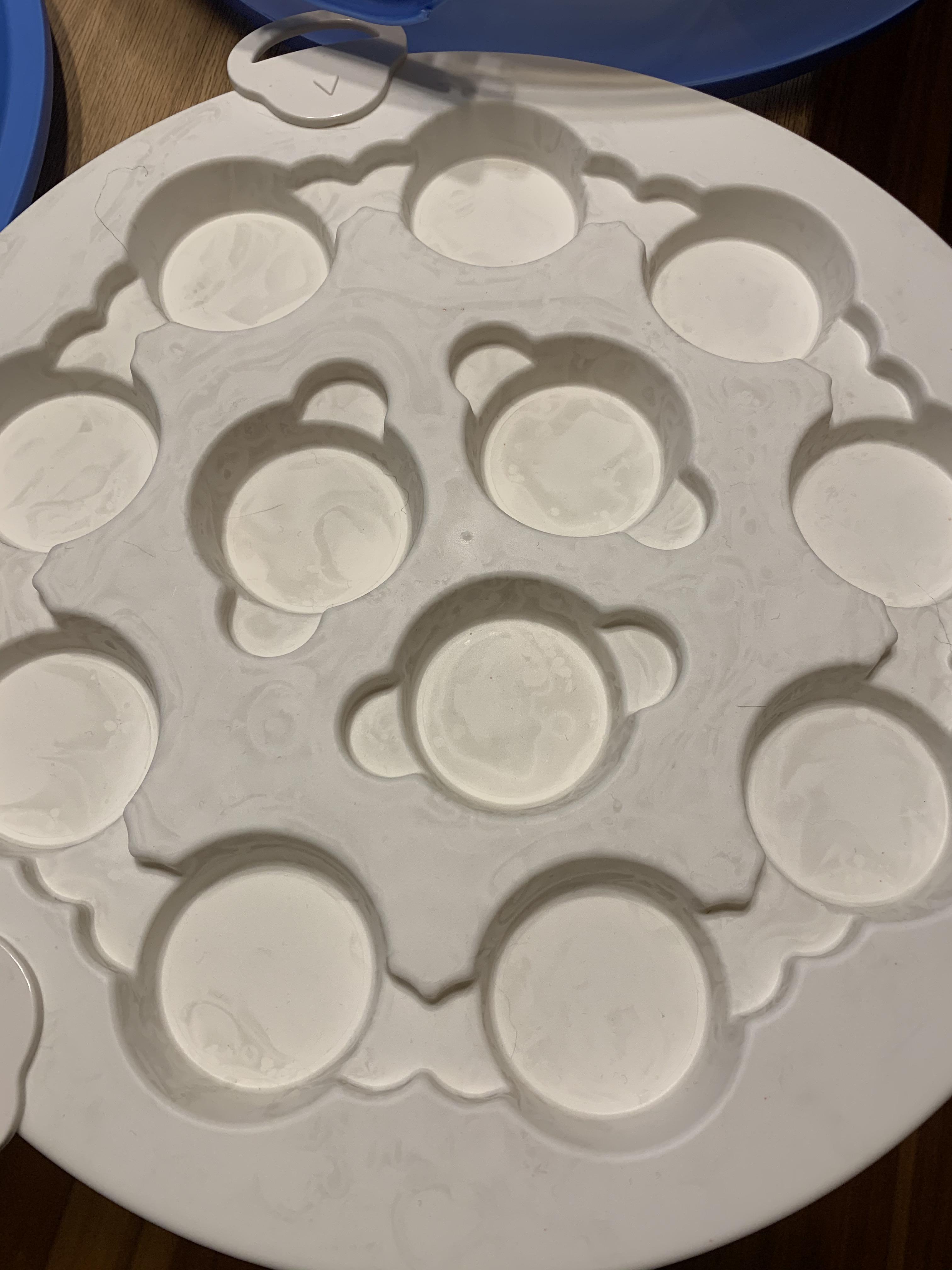 What are these grey marks on my clean dishes? It’s happened on a few plastic white dishes. They